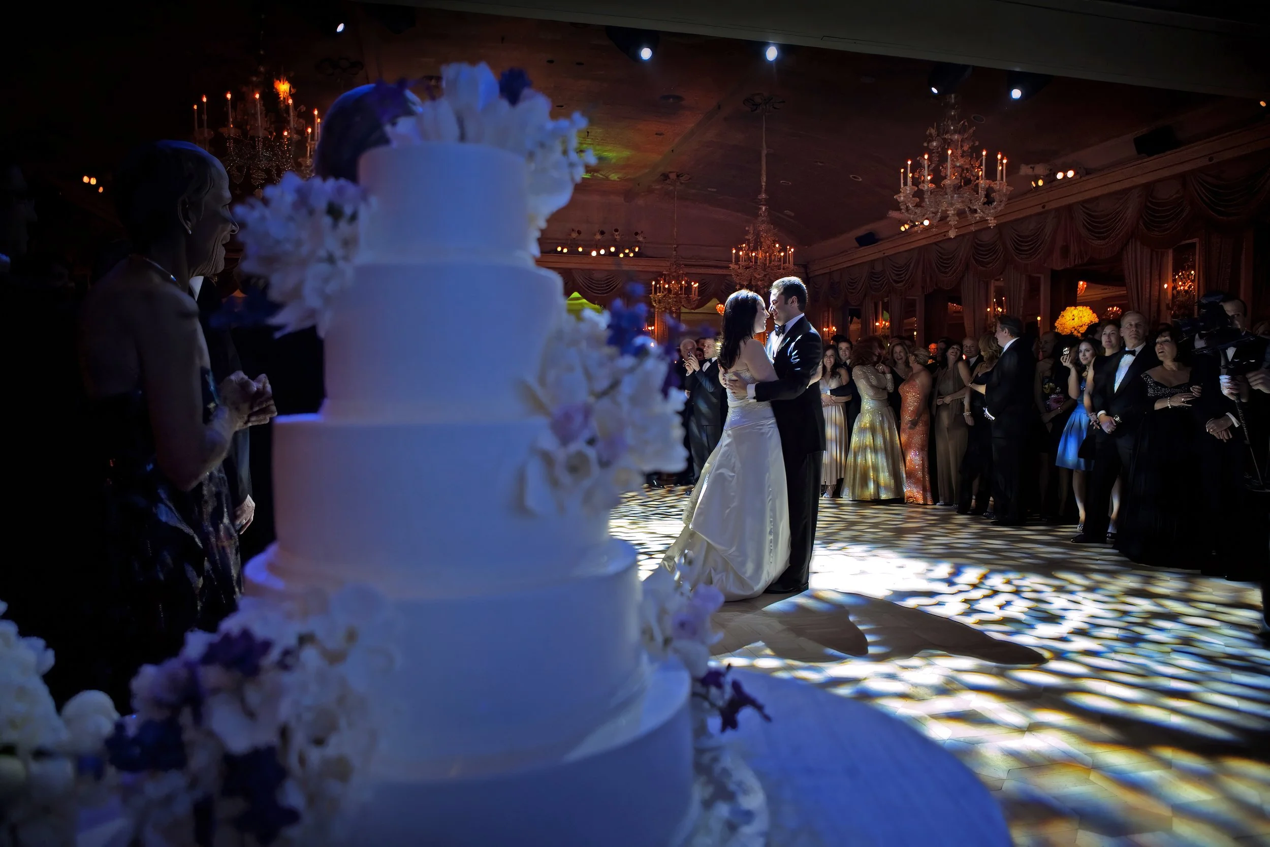 First Dance Framed by Wedding Cake