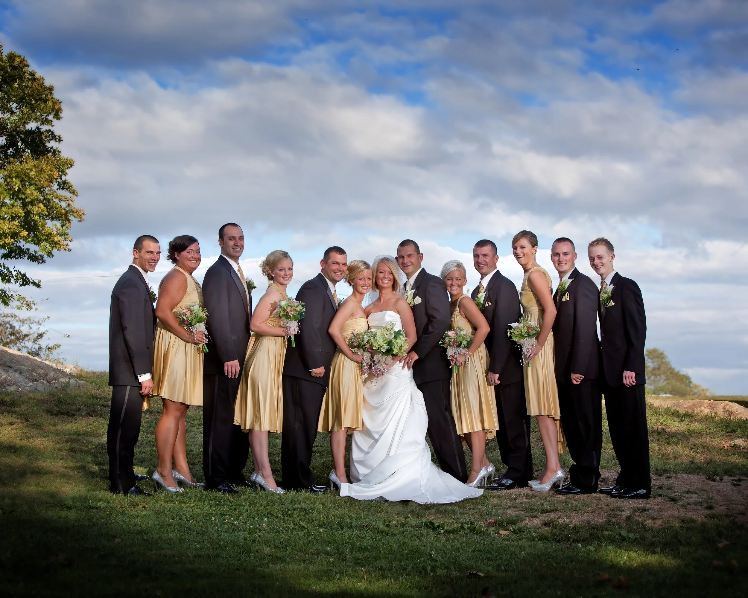 Wedding party group portrait on the grounds of Lighthouse Point Park in New Haven Connecticut