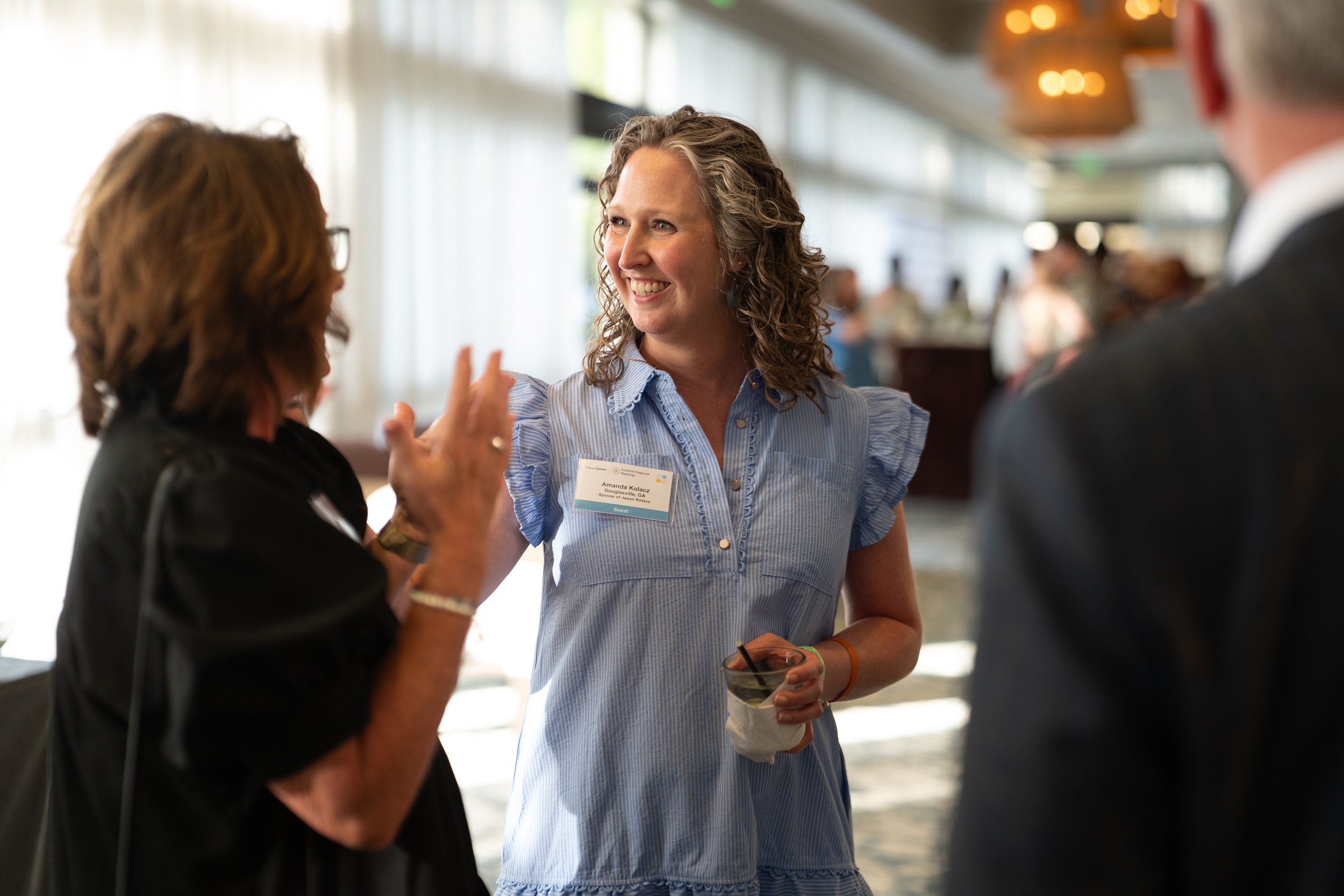 Attendees networking during cocktail hour at a corporate event photographed at Sonesta Resort Hilton Head.