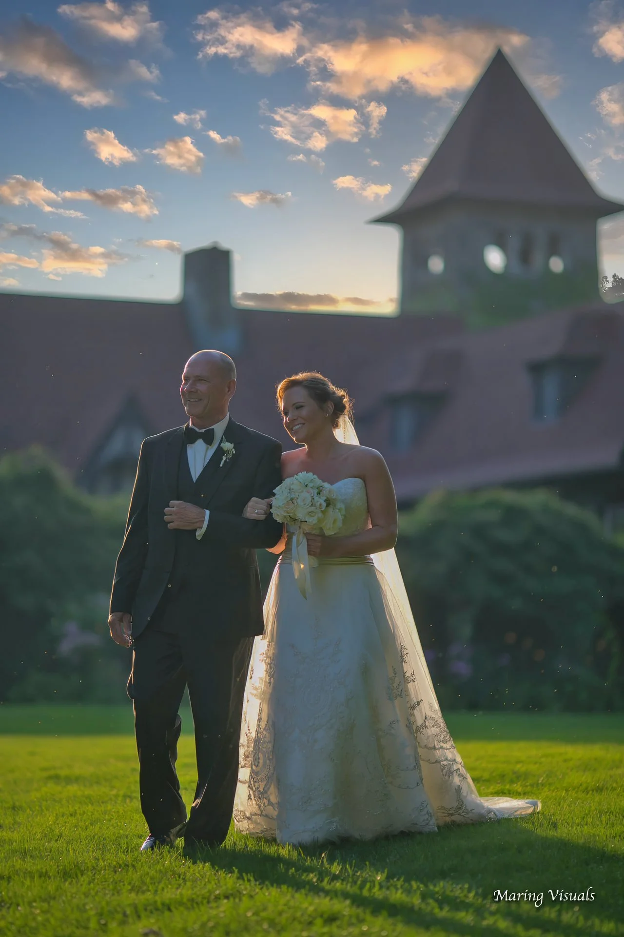 The bride walks down the aisle at an outdoor ceremony at Saint Clements Castle Connecticut