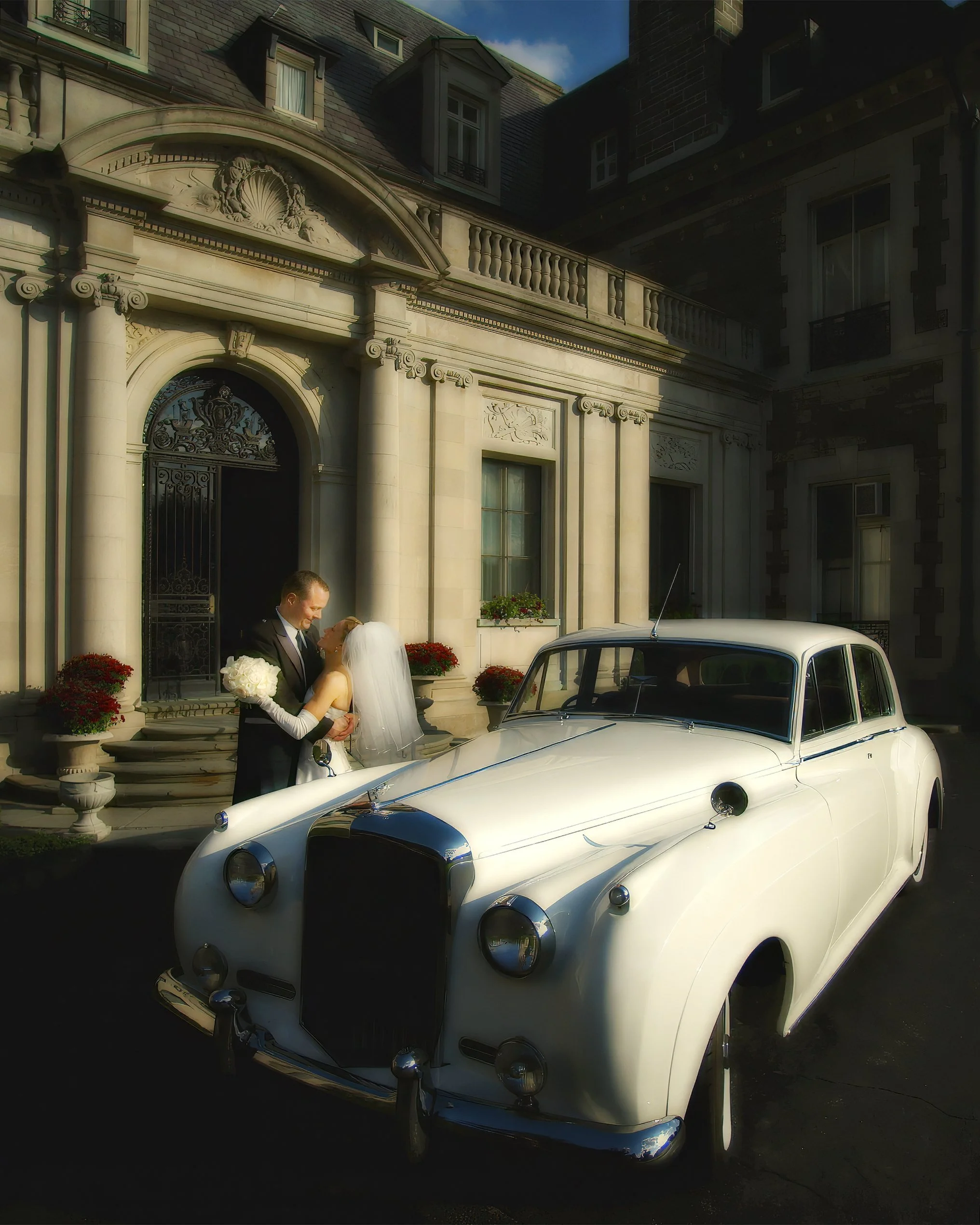 Bride and groom arrive at Aldrich Mansion in a vintage limousine and pause for a portrait.