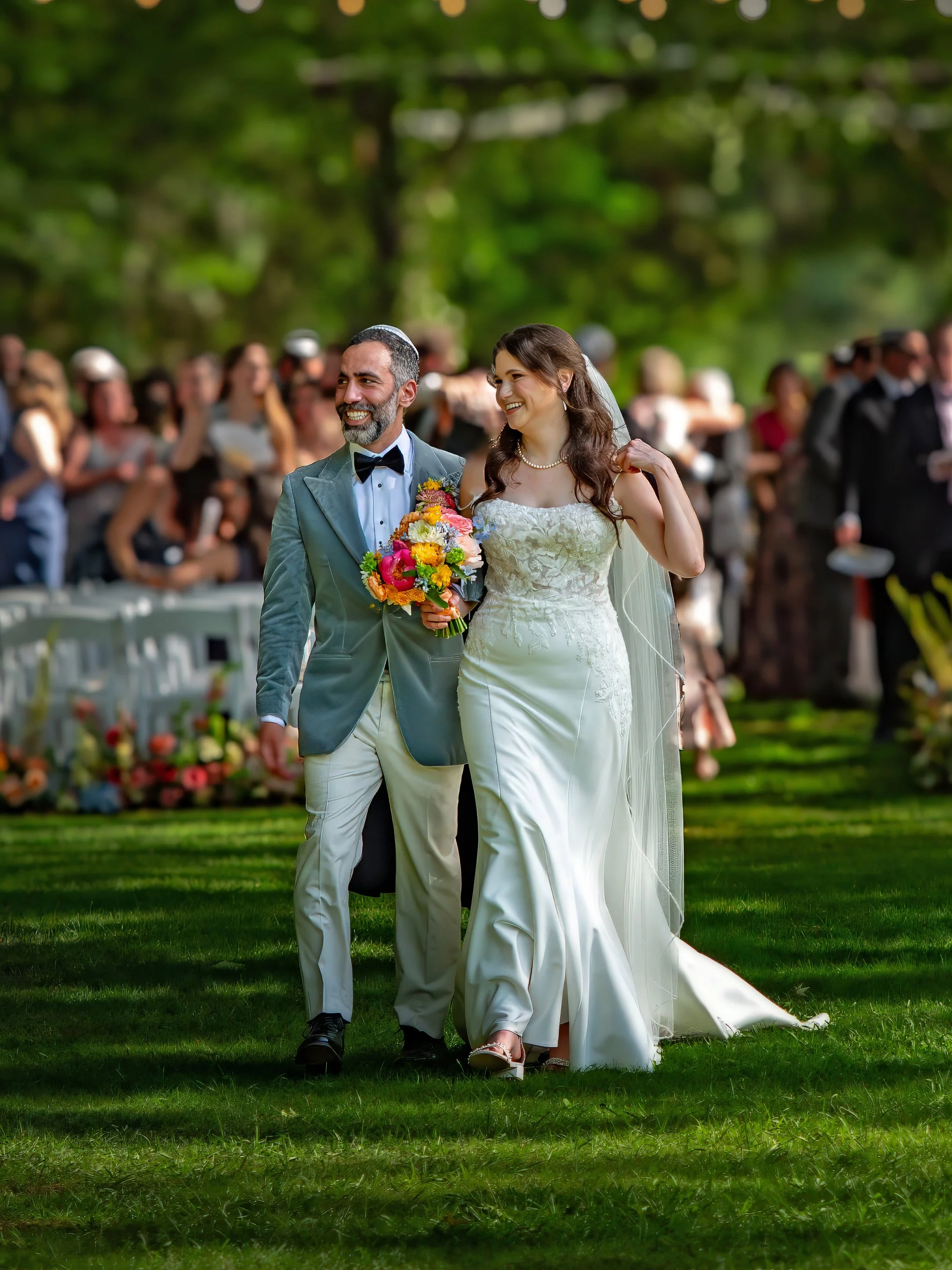 Bride and groom celebrate as they exit their wedding ceremony at The Mackey House in Savannah, Georgia.