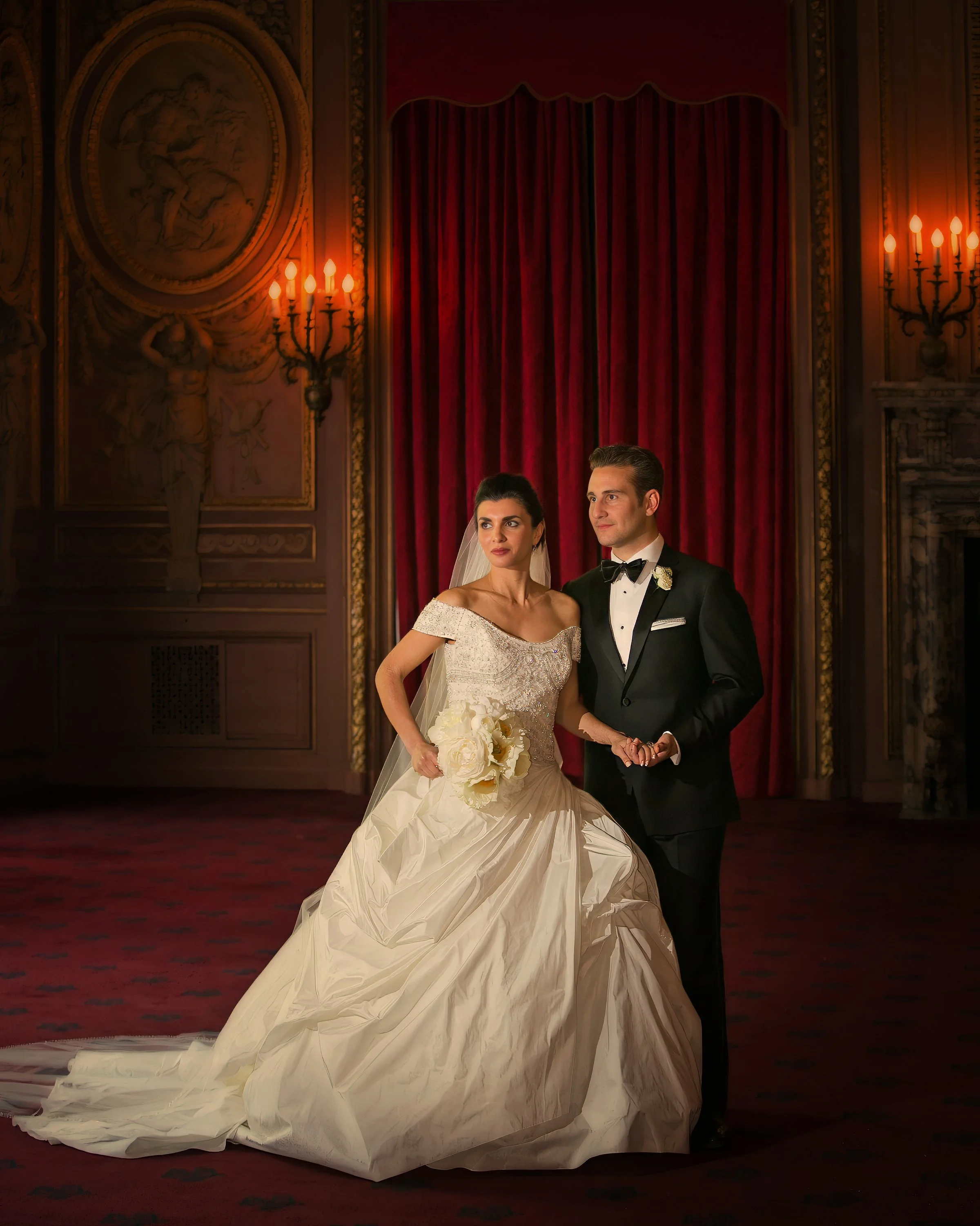 Bride and groom posing for a luxury wedding portrait in an ornate salon at The Metropolitan Club New York.