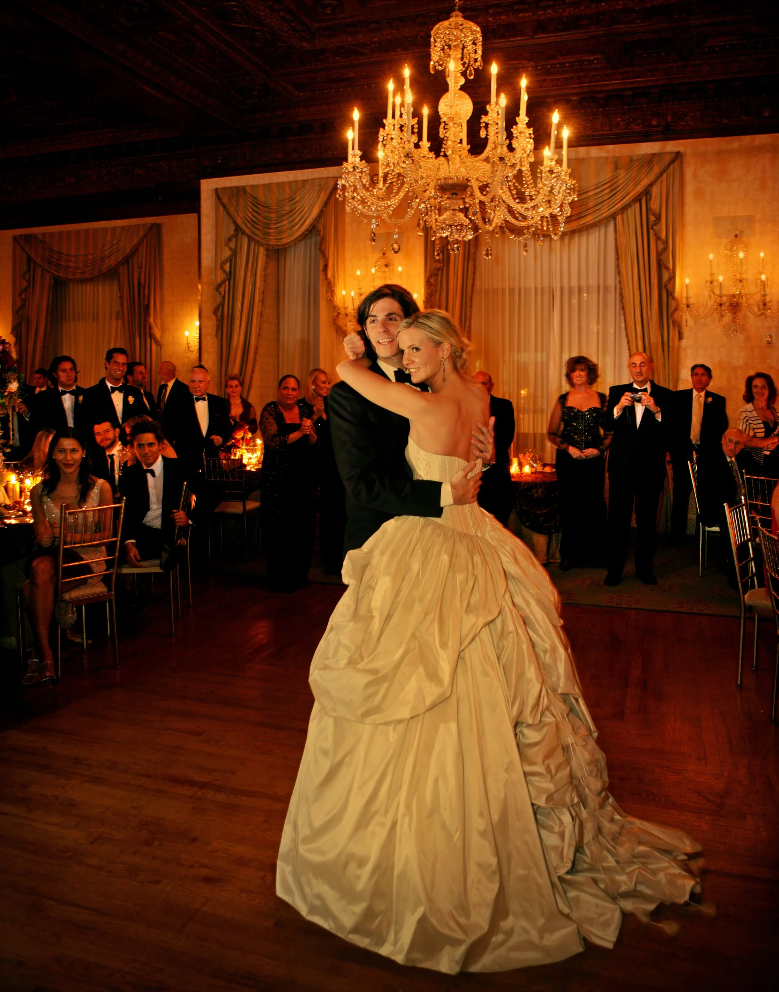 Bride and groom’s first dance at the Harmonie Club in Manhattan with warm lighting