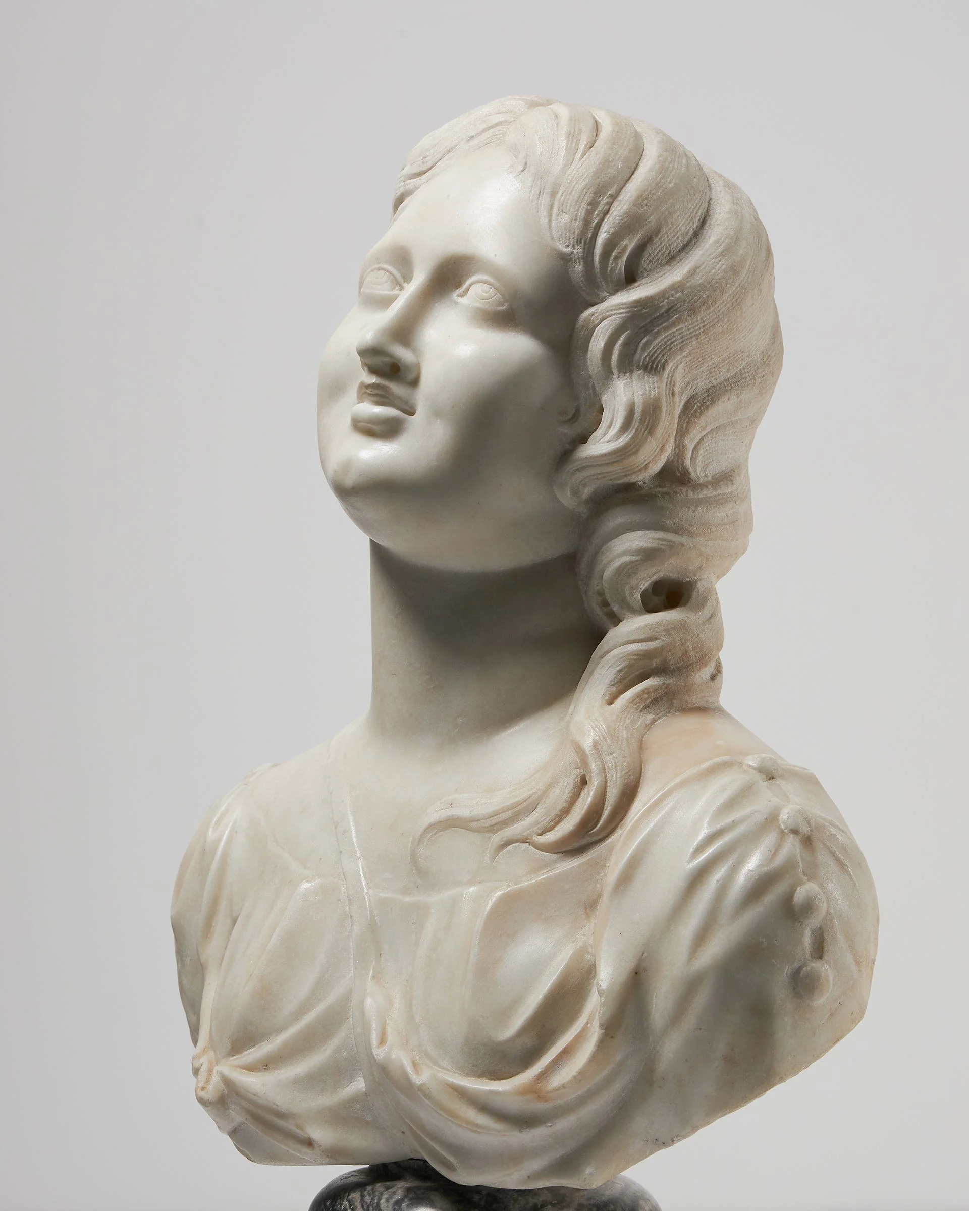 Spotlight on a Baroque marble bust of a goddess