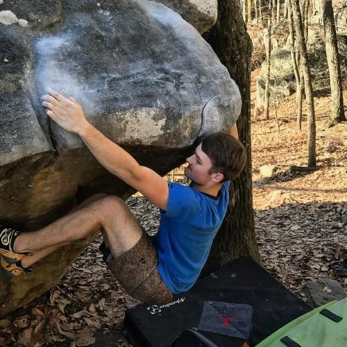 Assistant Head Coach Vinny Varsalona is a full-time student at Chattahoochee Technical College pursuing a degree in microbiology. He is native to Kennesaw, having lived here his whole life. He began climbing in early 2015 after visiting Escalade with his Scout group, though he chose to take it quite seriously in late 2016. Vinny is not somebody who you can describe as a “natural athlete.” He bounced around sports for a little while, though his true love has always been playing music. Climbing lends itself to creative thinking and attention to detail much like music. Once Vinny made this discovery, he fell in love with the sport. Having a less than athletic background, Vinny started from the ground up with climbing. With that he understands the value of hard work and is extremely patient and thorough when explaining new skills and tasks to those he teaches. He takes a musical approach in his teaching; do it slow until you can’t do it wrong, and commit to what you’re working on until it is complete. In addition to climbing, Vinny is a classical guitarist, and working toward his glider pilot’s license. A few of Coach Vinny’s favorite climbs are: Manute Bol V6, Stone Fort, TN Stretch Armstrong V6, Stone Fort, TN Alligator Sit Vweird, Boat Rock, GA Bum Boy V3, Horse Pens 40, AL Sternum V5, Stone Fort, TN