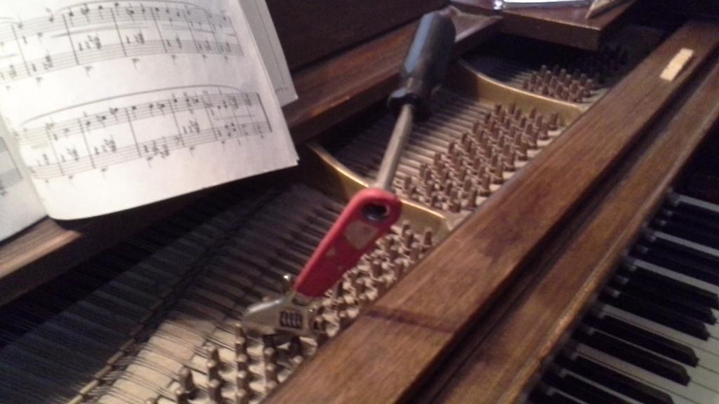Whatever you do, DO NOT DO THIS . According to the original poster, this setup "works pretty well." This person has obviously never used a real tuning hammer. Not only will it be nearly impossible to precisely adjust a tuning pin this way, it will also likely damage the tuning pins.