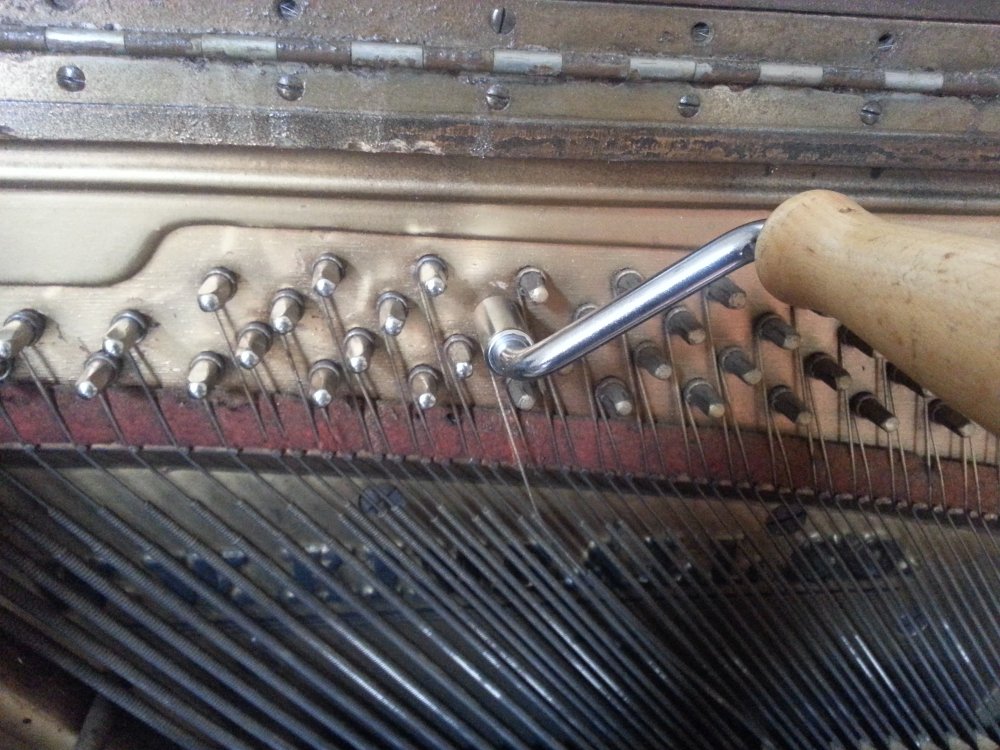 Spinning the pin out with a stringing crank.