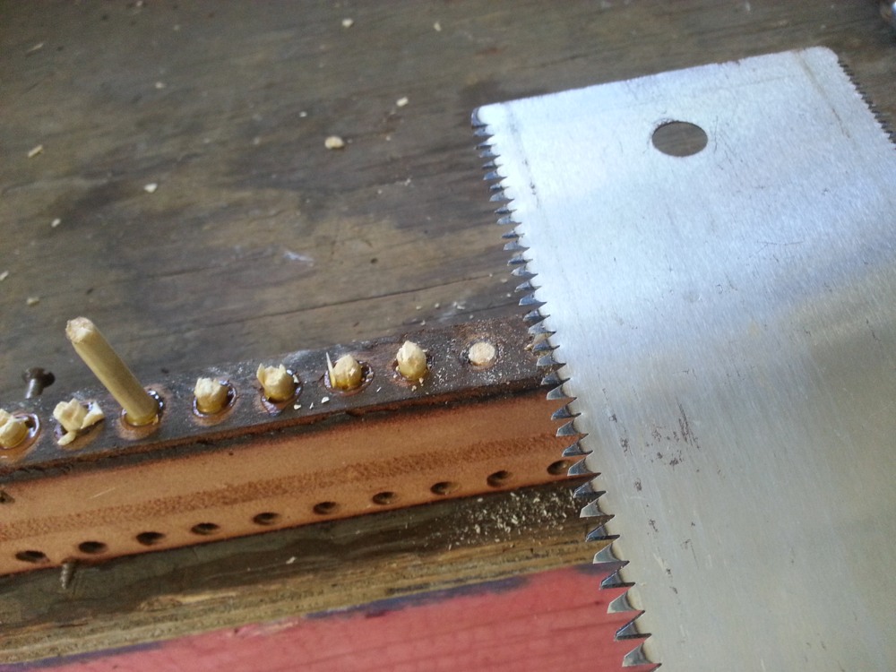 Flush cutting the dowels.