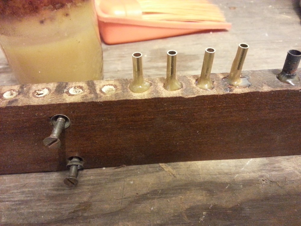Spin the connector into the pouch board to create a collar of burnt shellac.