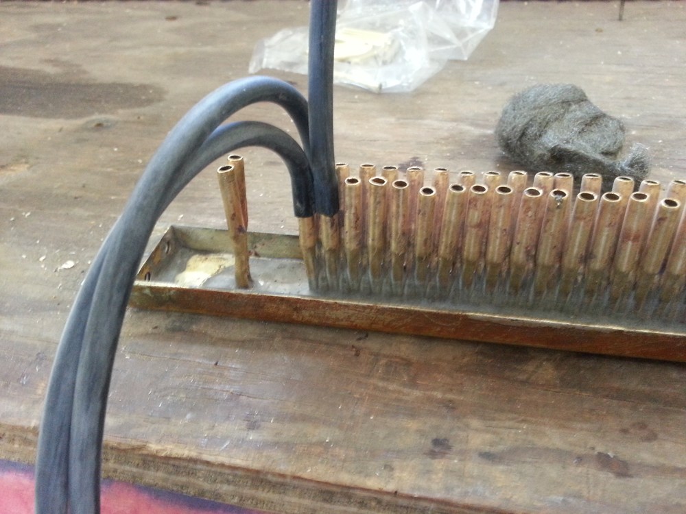 Pushing the tubing onto the tracker bar nipple.