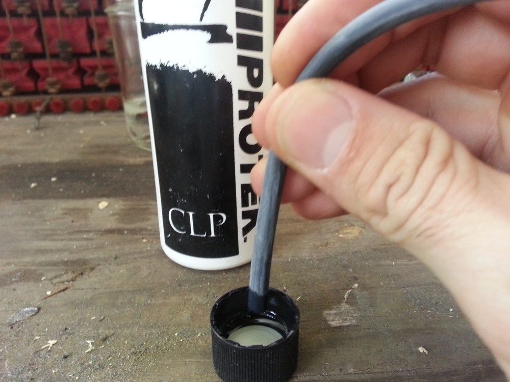 Lubricating one end of the tubing.