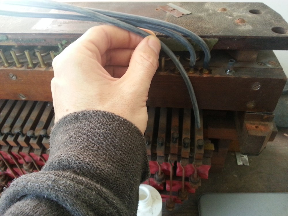 Attaching the tracker bar tubing to the brass connectors. Make sure the correct tube is being connected.