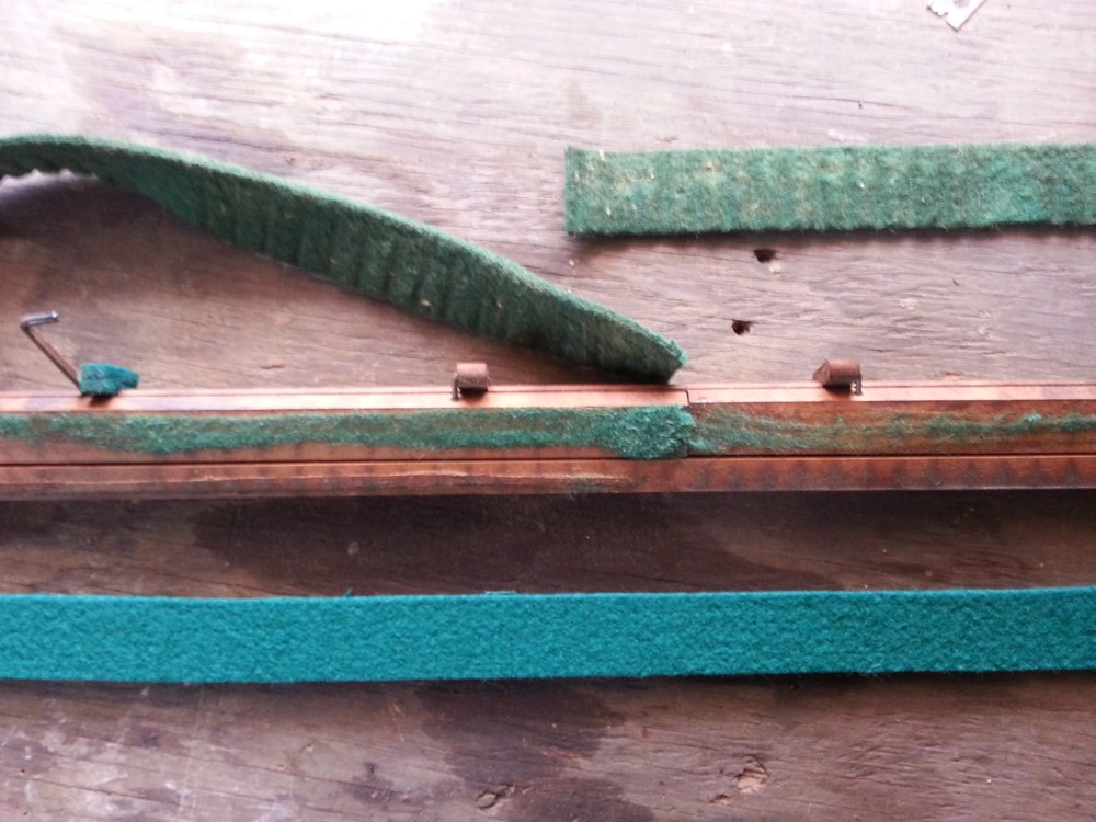 Old felt peeled away and new felt at the ready.