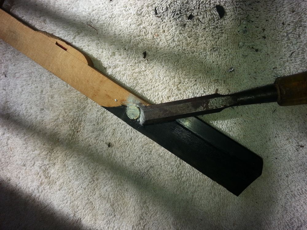 Pushing the chisel through the key-lead.