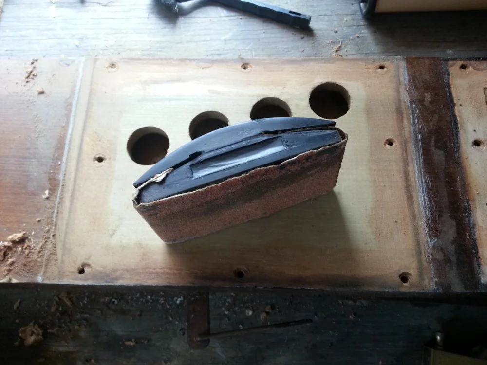 Smooth the board out with a sanding block.