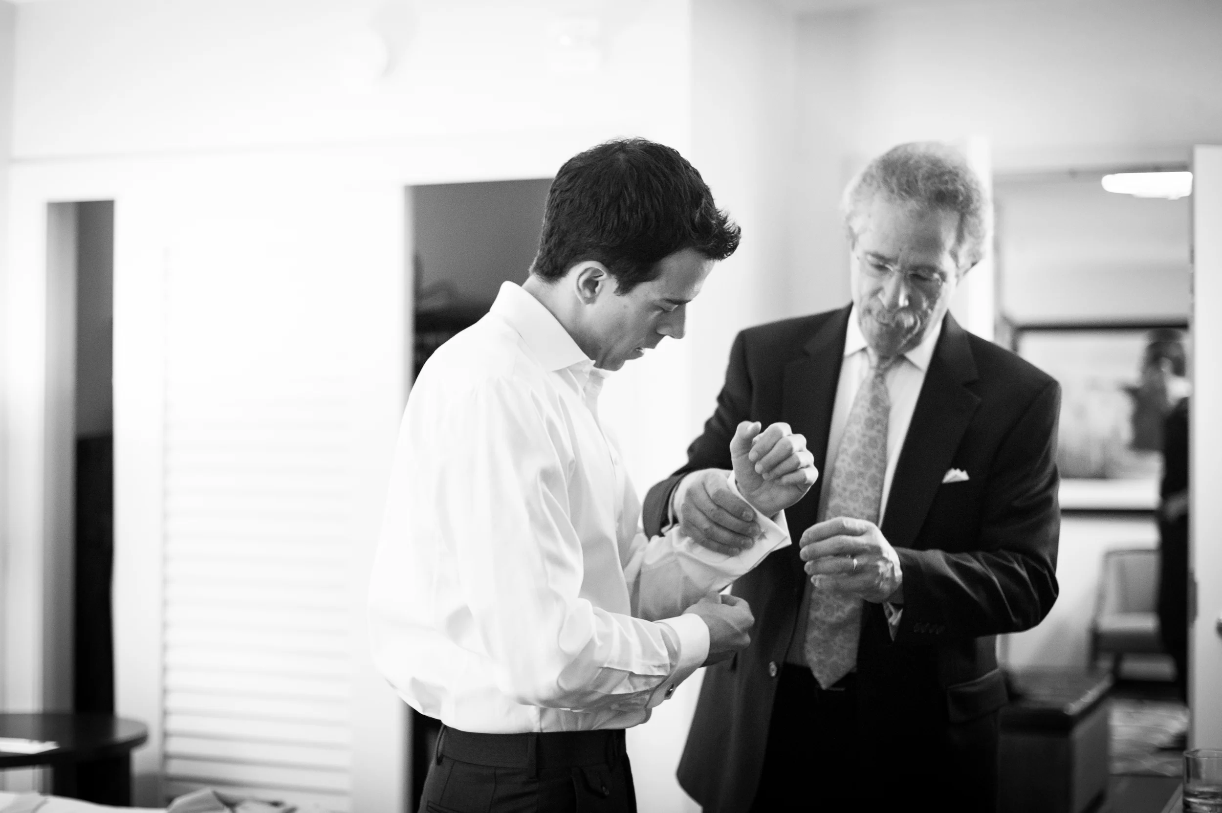 Image: Premack Weddings My dad helps my husband put on cufflinks that belonged to my Great-Grandfather on our wedding day.
