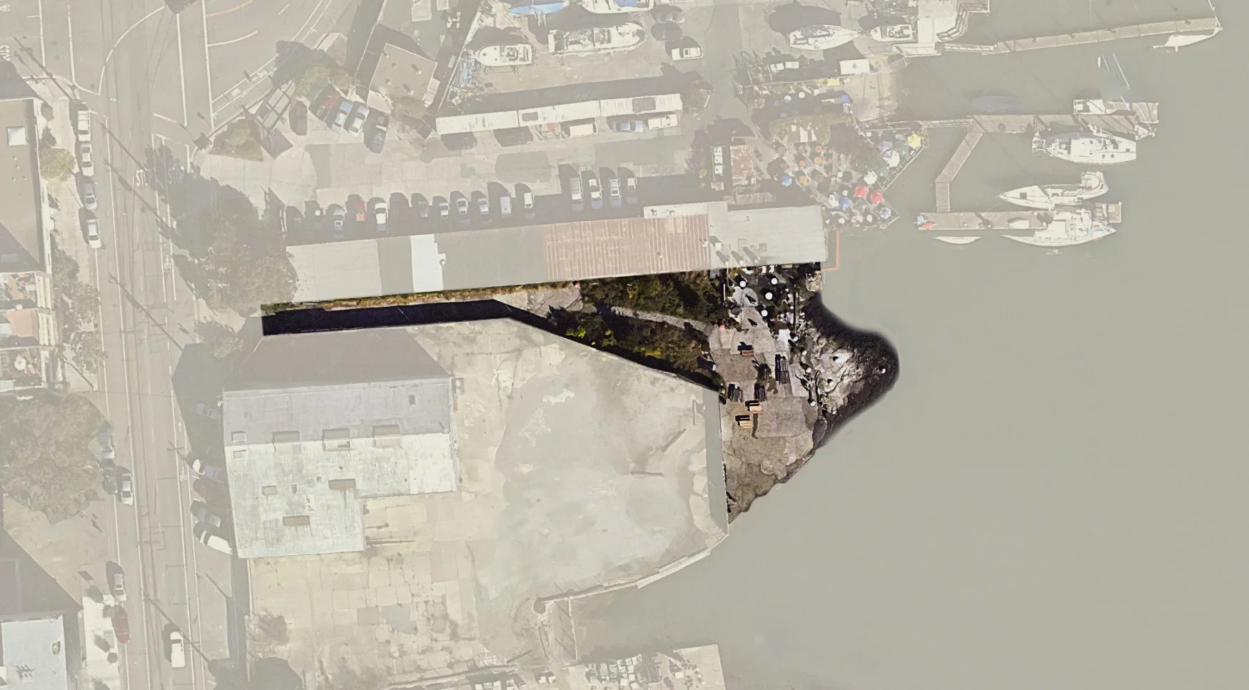 The tiny, informal public shore that will be enveloped and redeveloped as part of the new Crane Cove Park. 