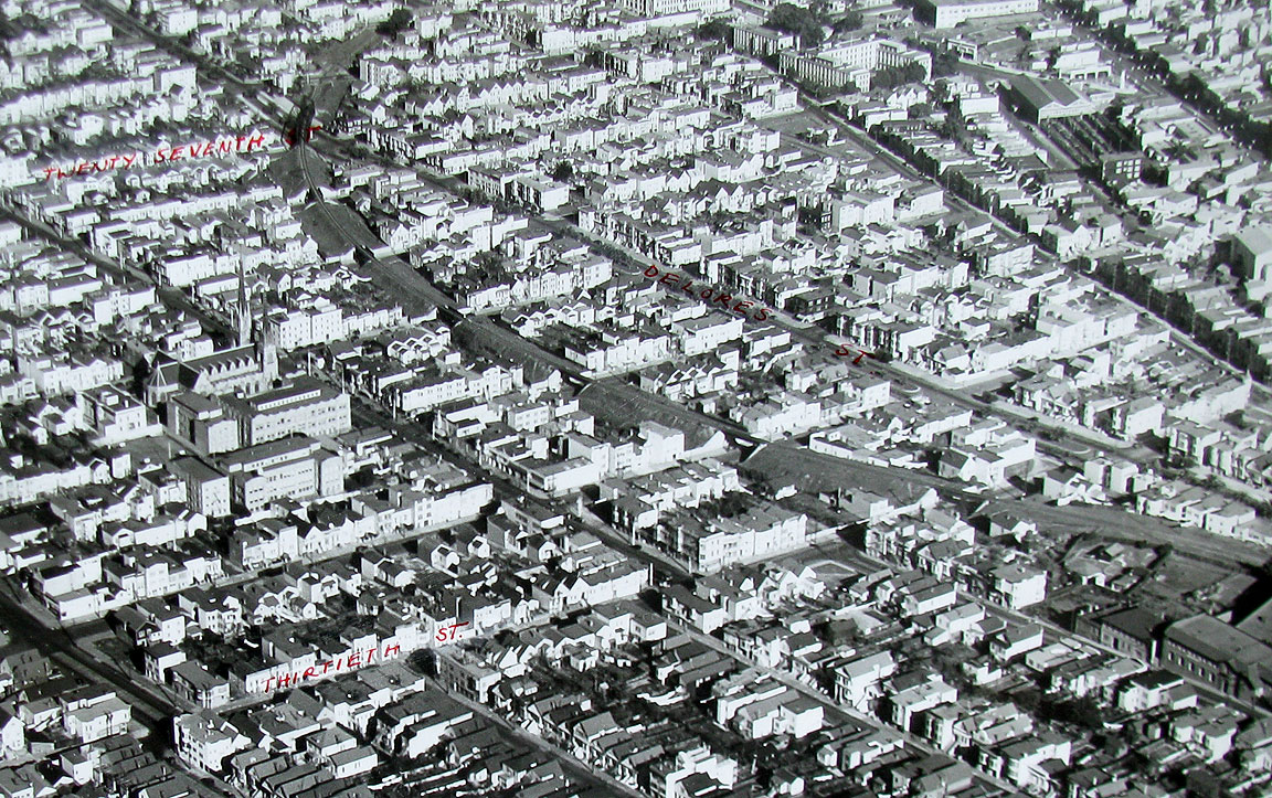 1940's aerial clearly showing the train route cutting through the gird image: foundsf.org