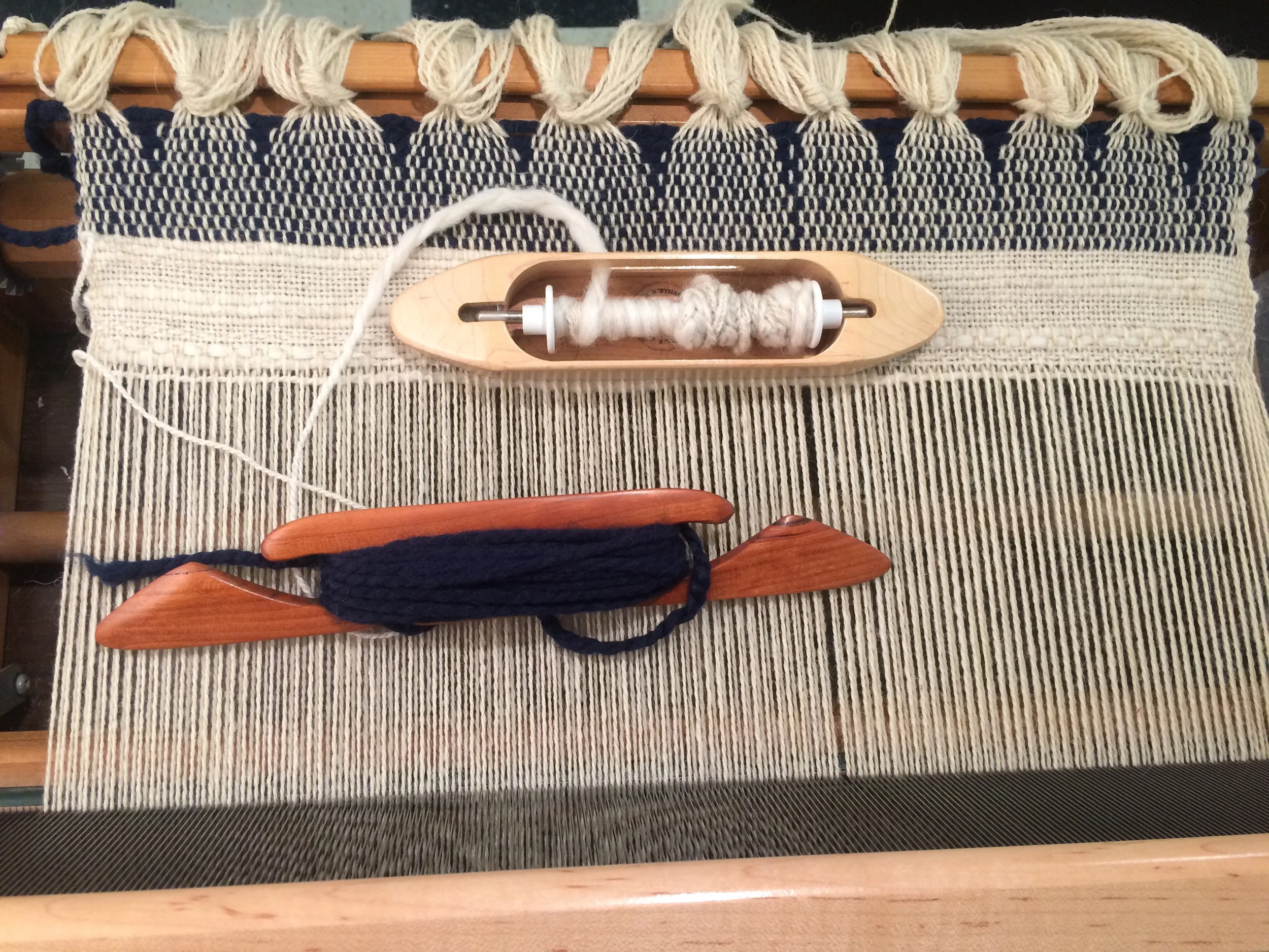 Shuttles of thread ready for weaving.