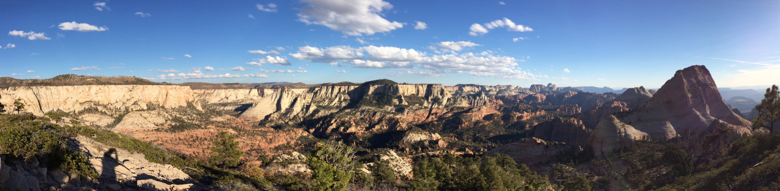 iPhone pano from atop East Northgate Peak. Zion Canyon is in the distance and somewhere between me and the canyon is Subway. The prominent peak on the right is the North Guardian Angel and the South Guardian Angel is just beyond that.