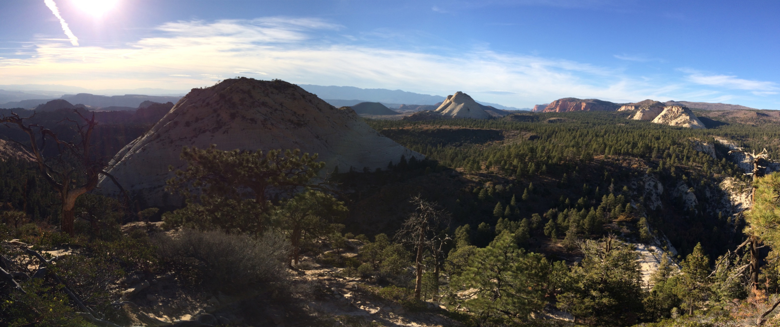 iPhone pano from atop East Northgate Peak. The rounded summit in the left mid ground is West Northgate Peak. The isolated white peak in the distance just right of center is Pine Valley Peak.
