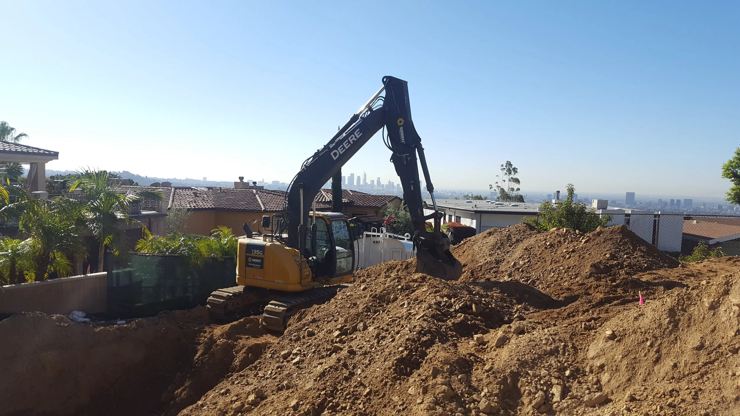 Hillside Excavation and grading project. 15 feet below grade, into Bedrock.