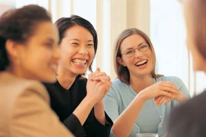 Businesswomen-laughing-in-meeting_dv496065b.jpg