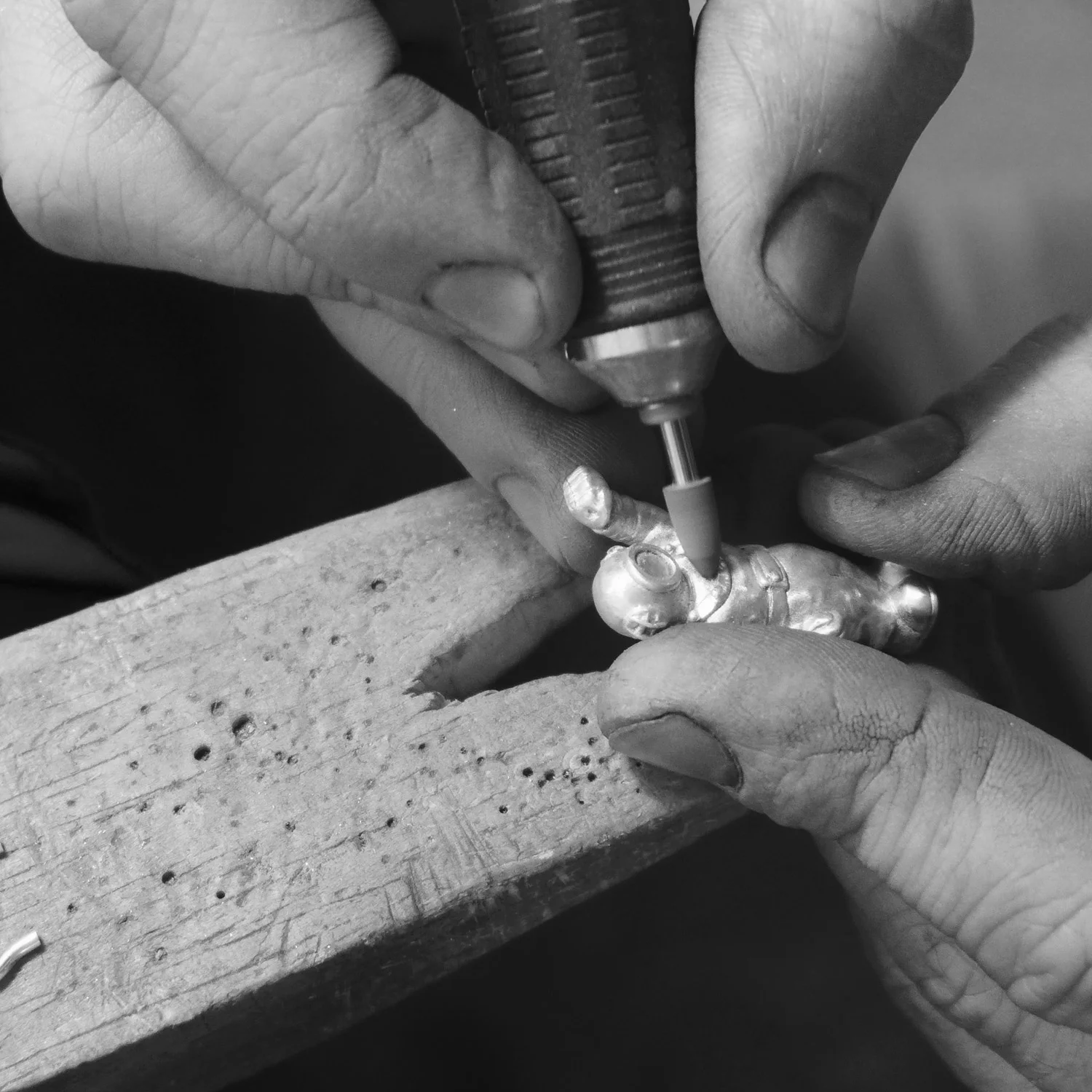 A series of files and tools are used to clean up the casting.