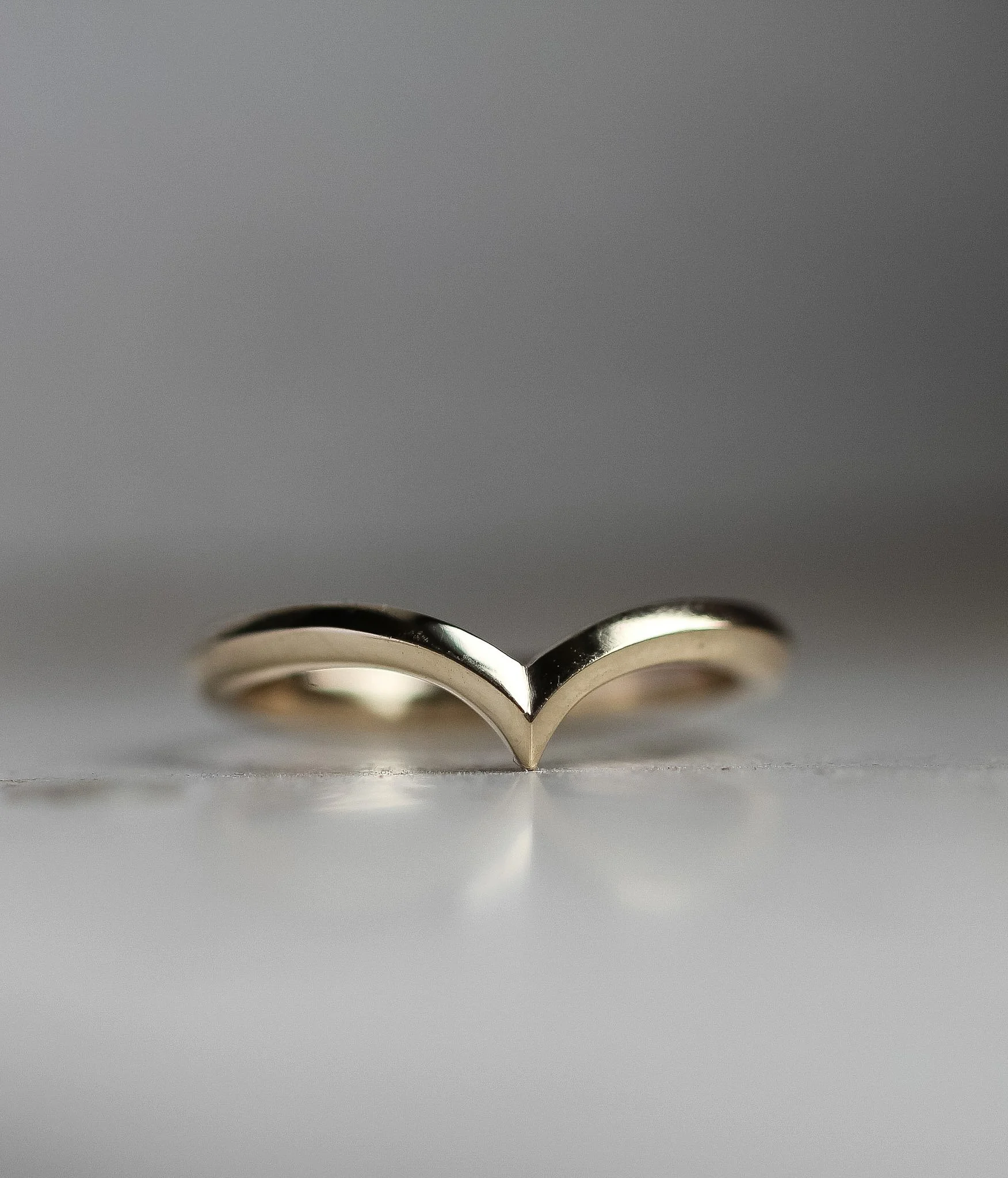 Wishbone shaped wedding band. With knife edge profile.