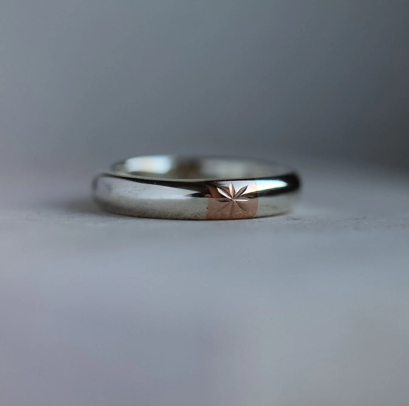 Wedding band, made from white and rose gold. The rose gold section uses metal from a parents wedding ring.