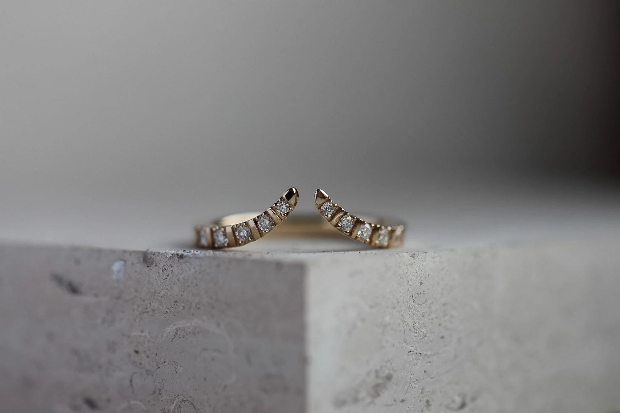 Wishbone ring with diamonds set into the band.