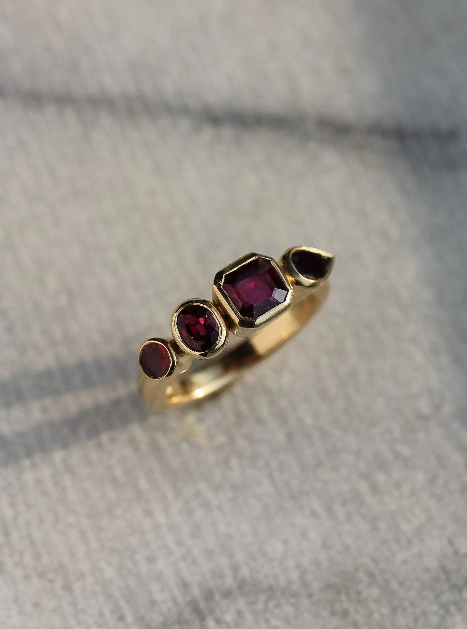 Rubies in bezel settings, made from 18ct yellow gold.