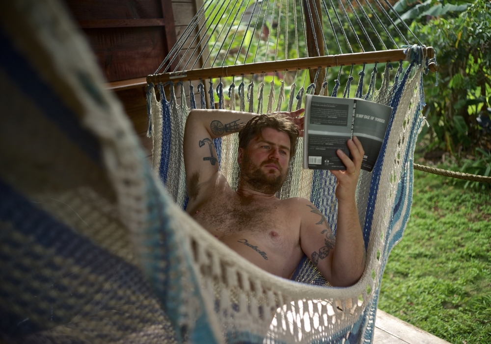 i don't read often but when i do i prefer to read in a hammock. and i like to turn the page from behind my head.
