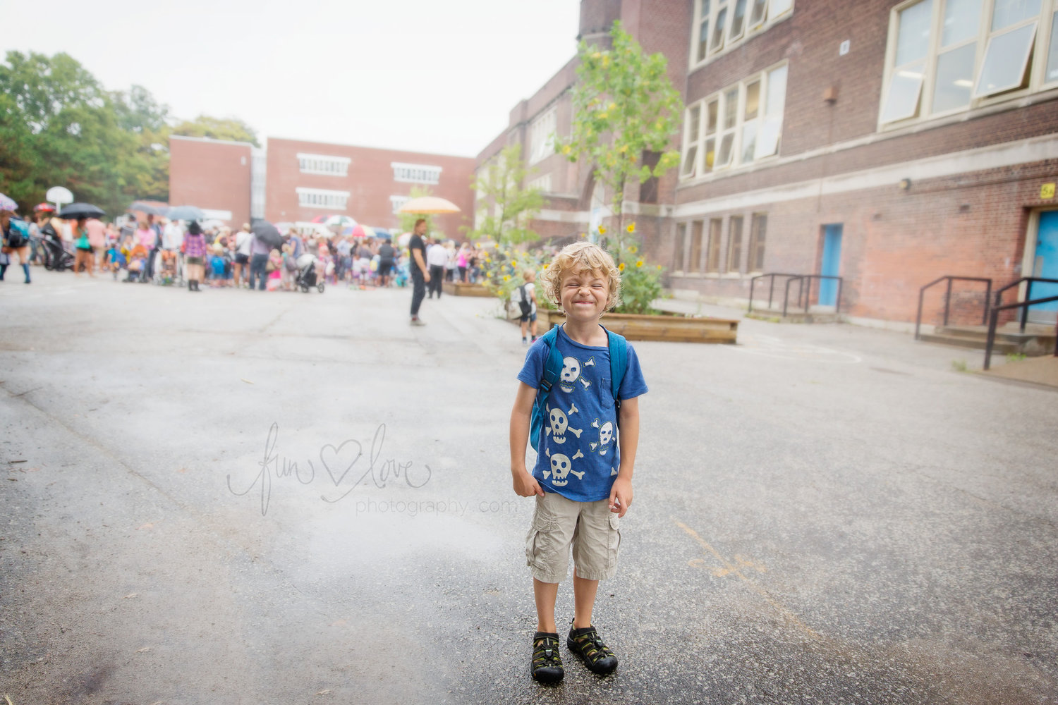 On the school grounds on a rainy first morning. Goofing a bit - excited but a bit nervous!