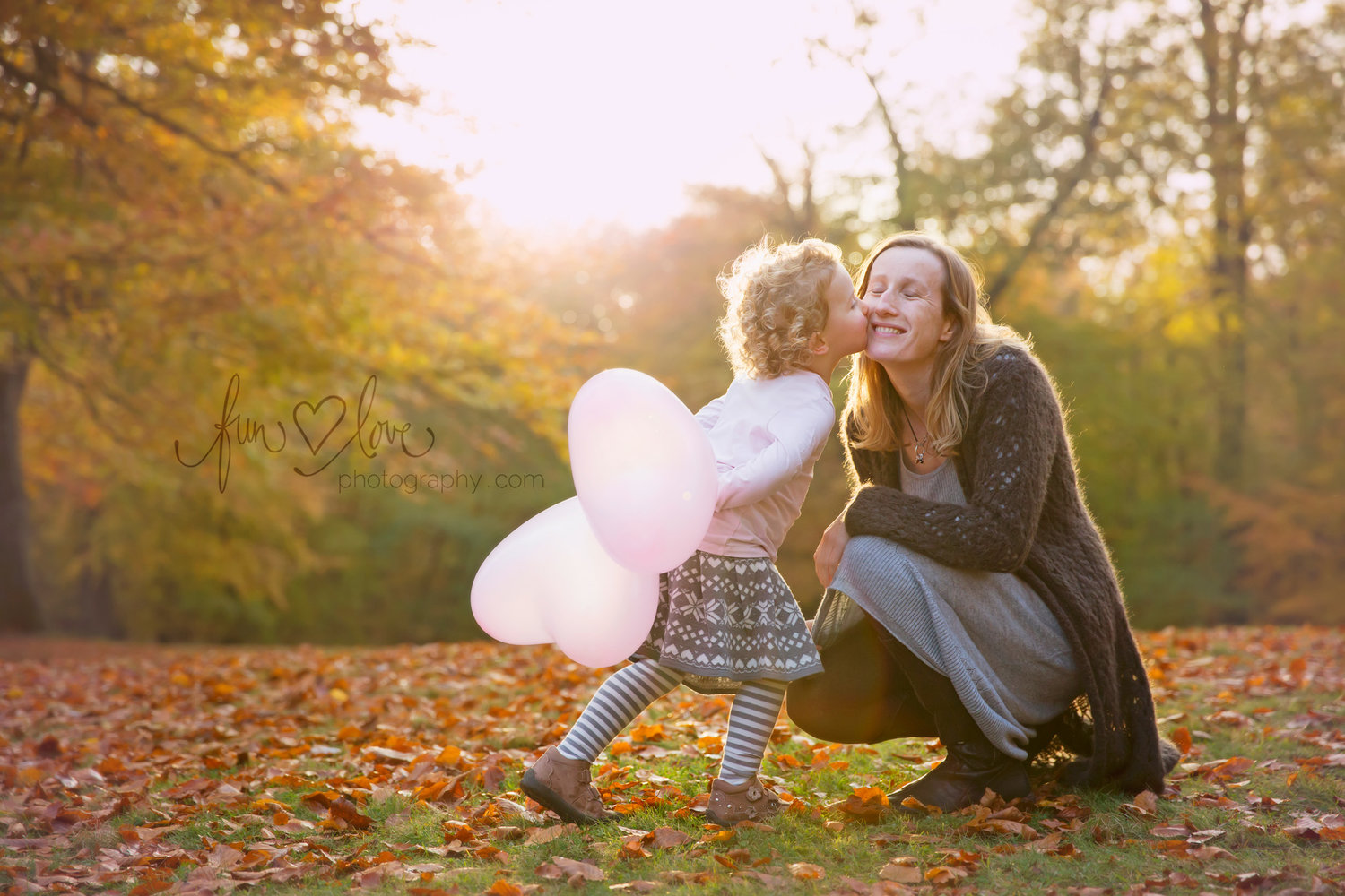 girl and mom beautiful backlit fall scene