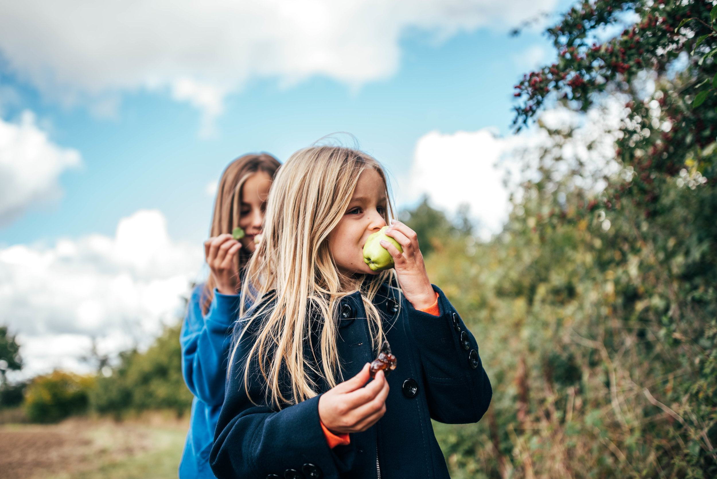 Girls eat apples Essex UK Documentary Portrait Photographer