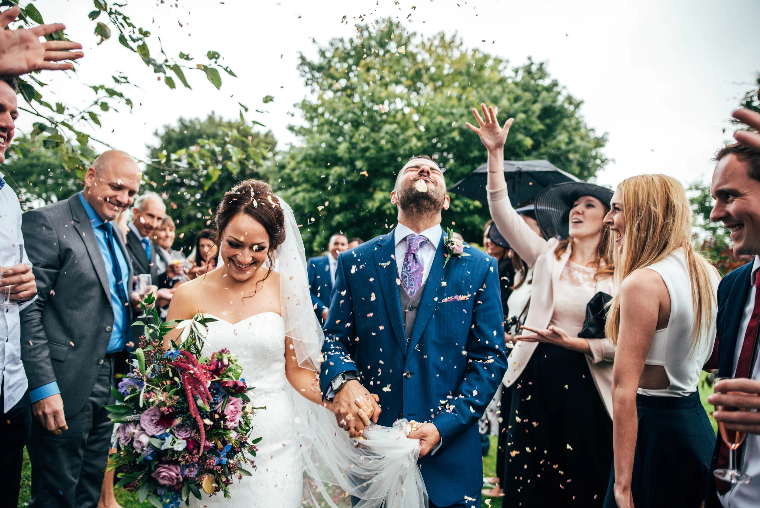 Essex UK Documentary Wedding Portrait Photographer Bright colours Bride & Groom walk through Confetti