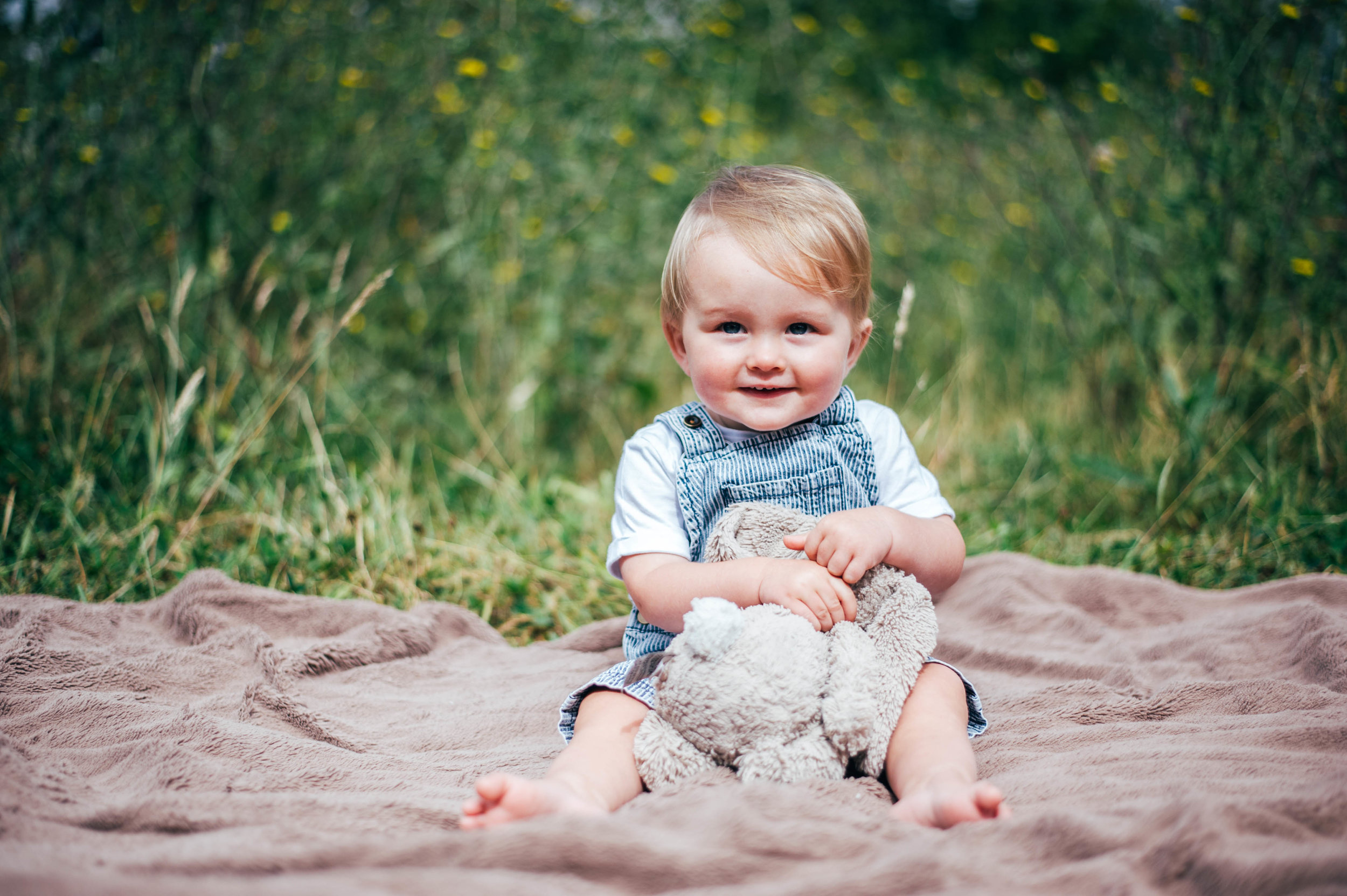 Baby boy on blanket with teddy Essex UK Documentary Portrait Photographer