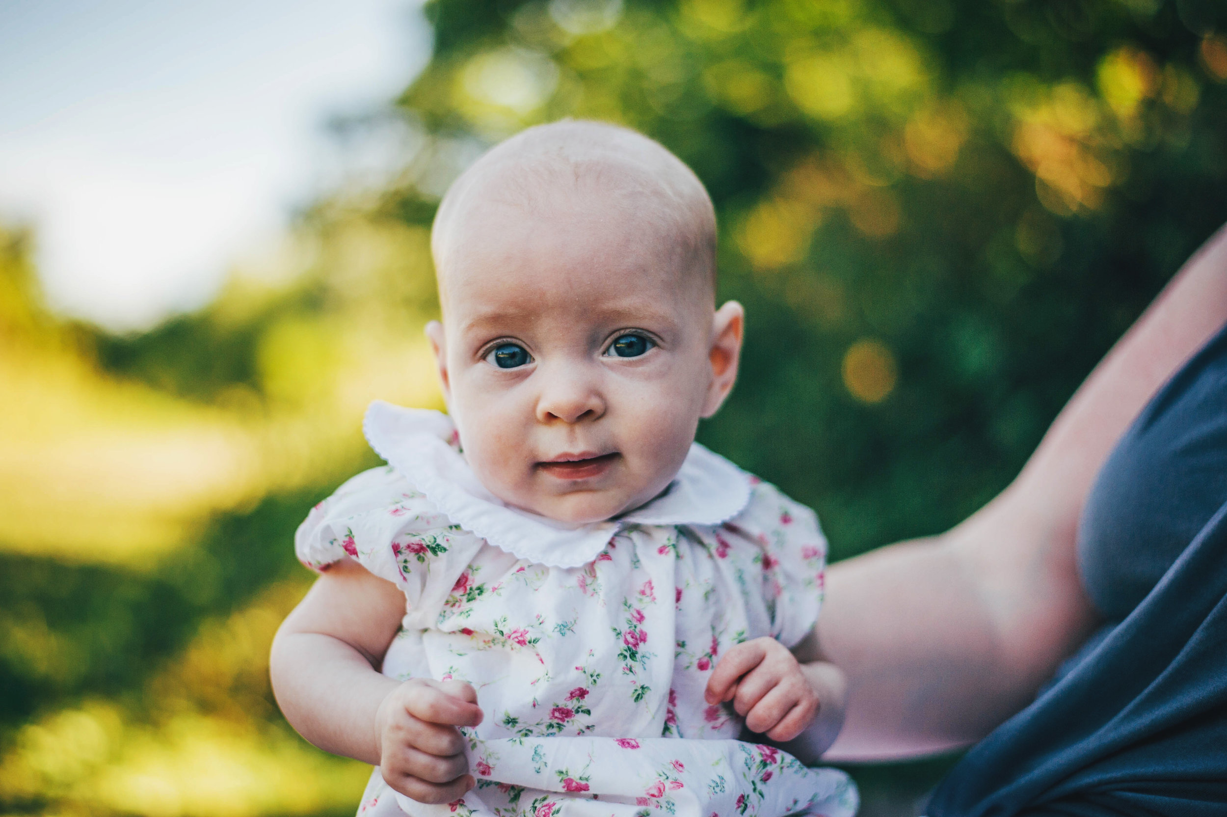 Baby girl in sunny Park Essex UK Natural Documentary Portrait Photographer