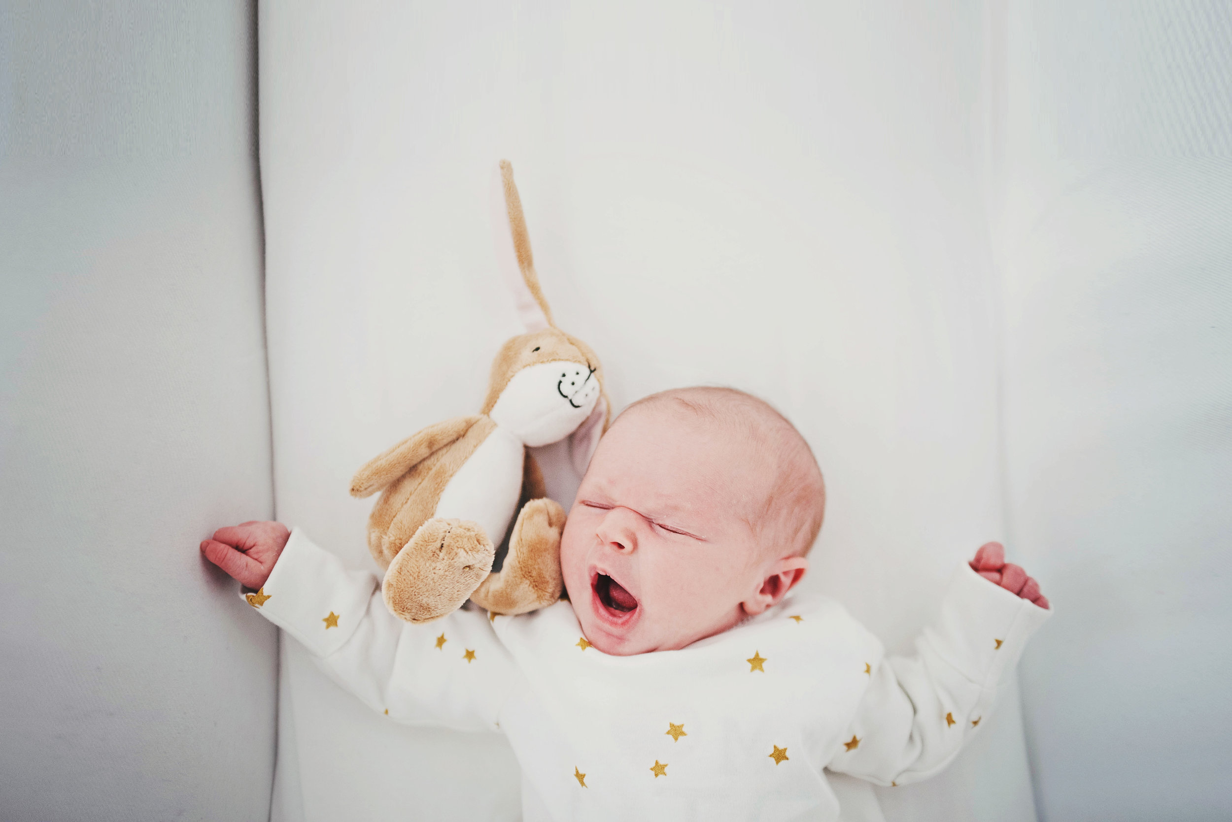 Yawning newborn baby At Home Lifestyle Shoot Essex UK Documentary Portrait Photographer