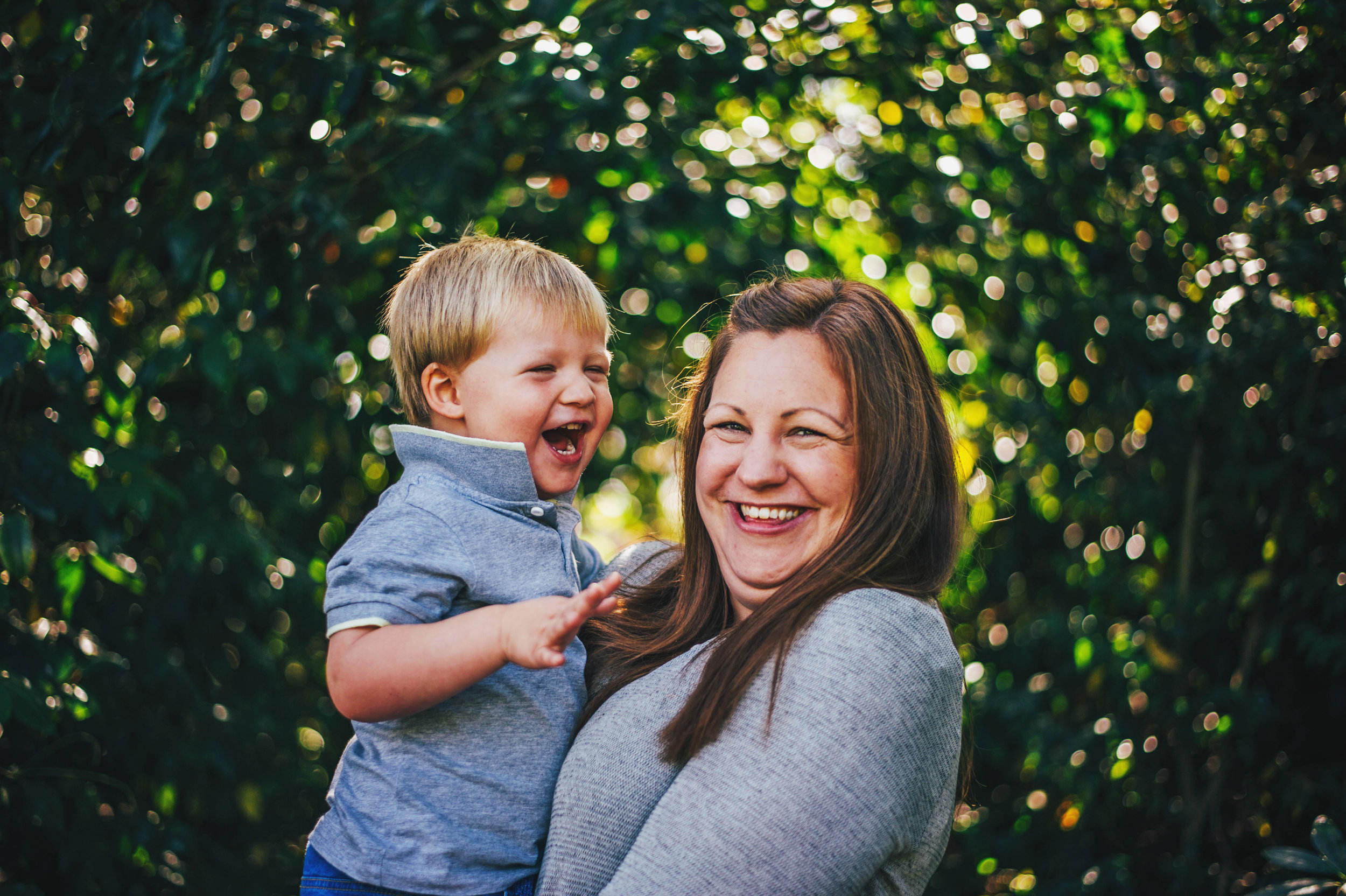 Little Boy and Mum laugh in Gardens at Hylands House Essex UK Documentary Portrait Photographer