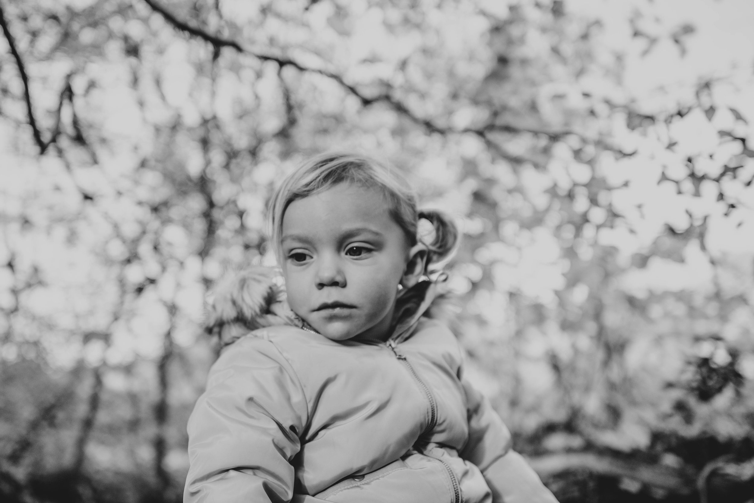 Little Girl with trees above Lifestyle Shoot Essex UK Documentary Portrait Photographer