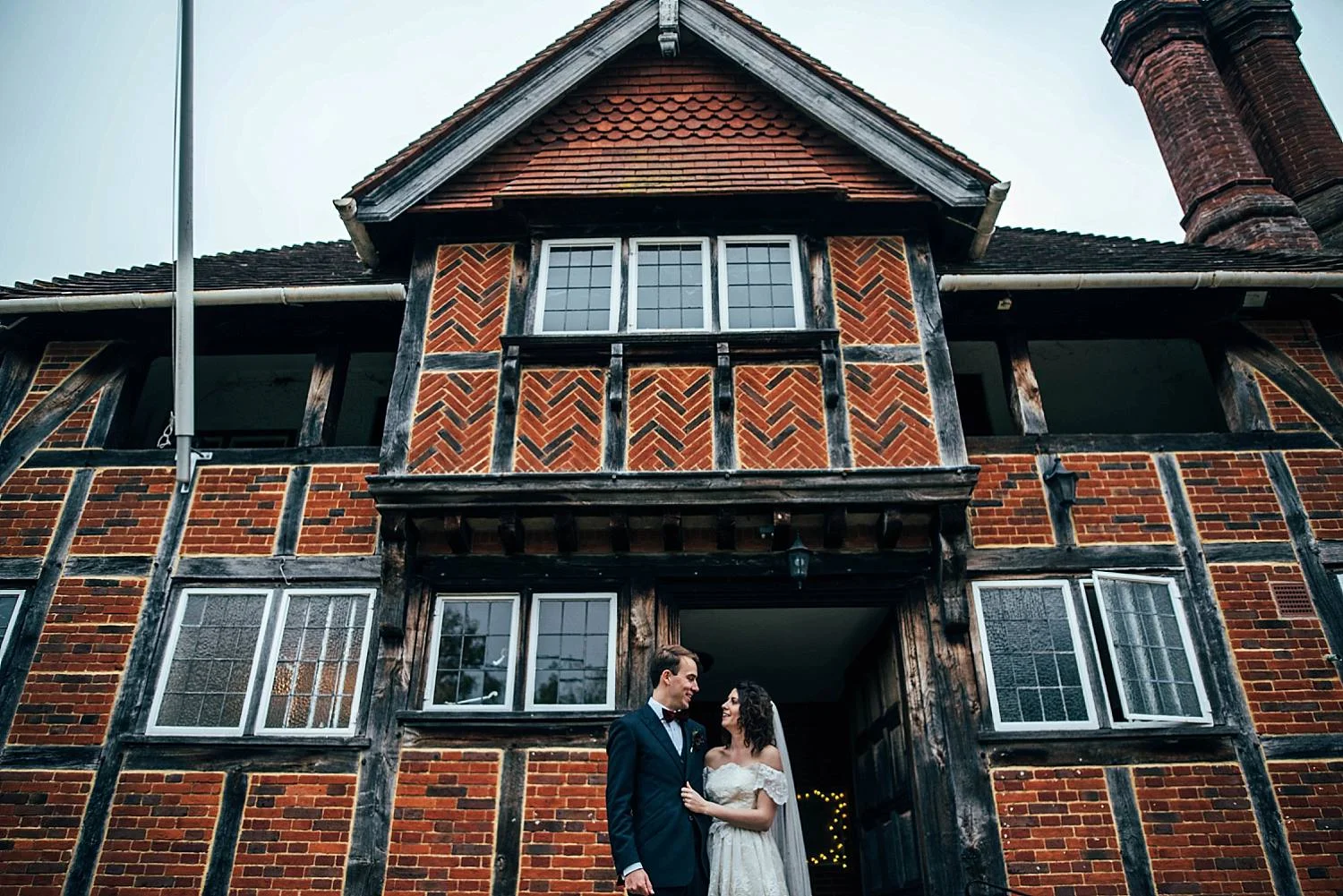 Gothic inspired village hall wedding bride wears her mothers 80s vintage dress Essex UK Documentary Photographer