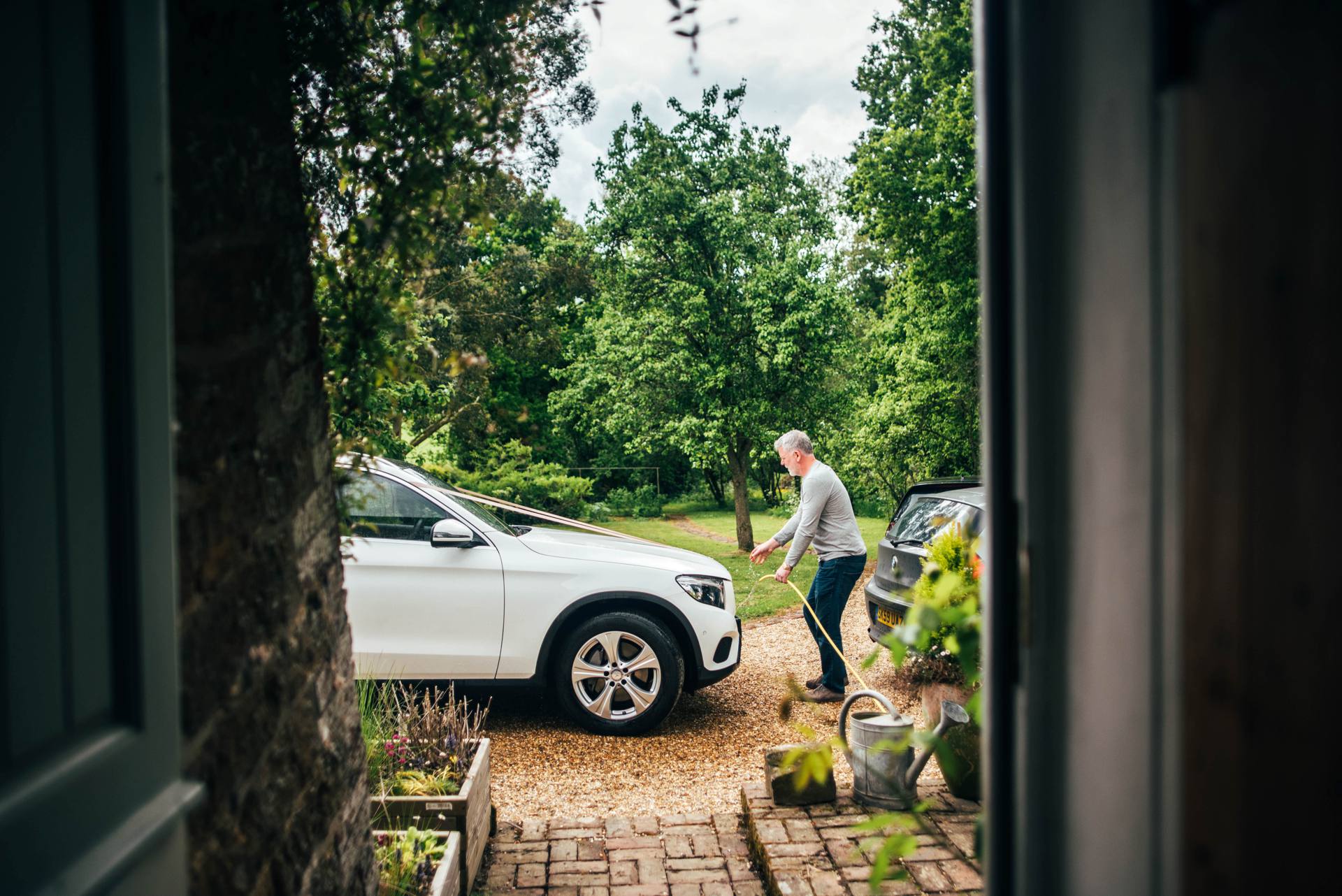 Stylish Elegant DIY Village Hall White and Green Wedding Bride wears Pronovias Three Flowers Photography Essex UK Documentary Wedding Photographer