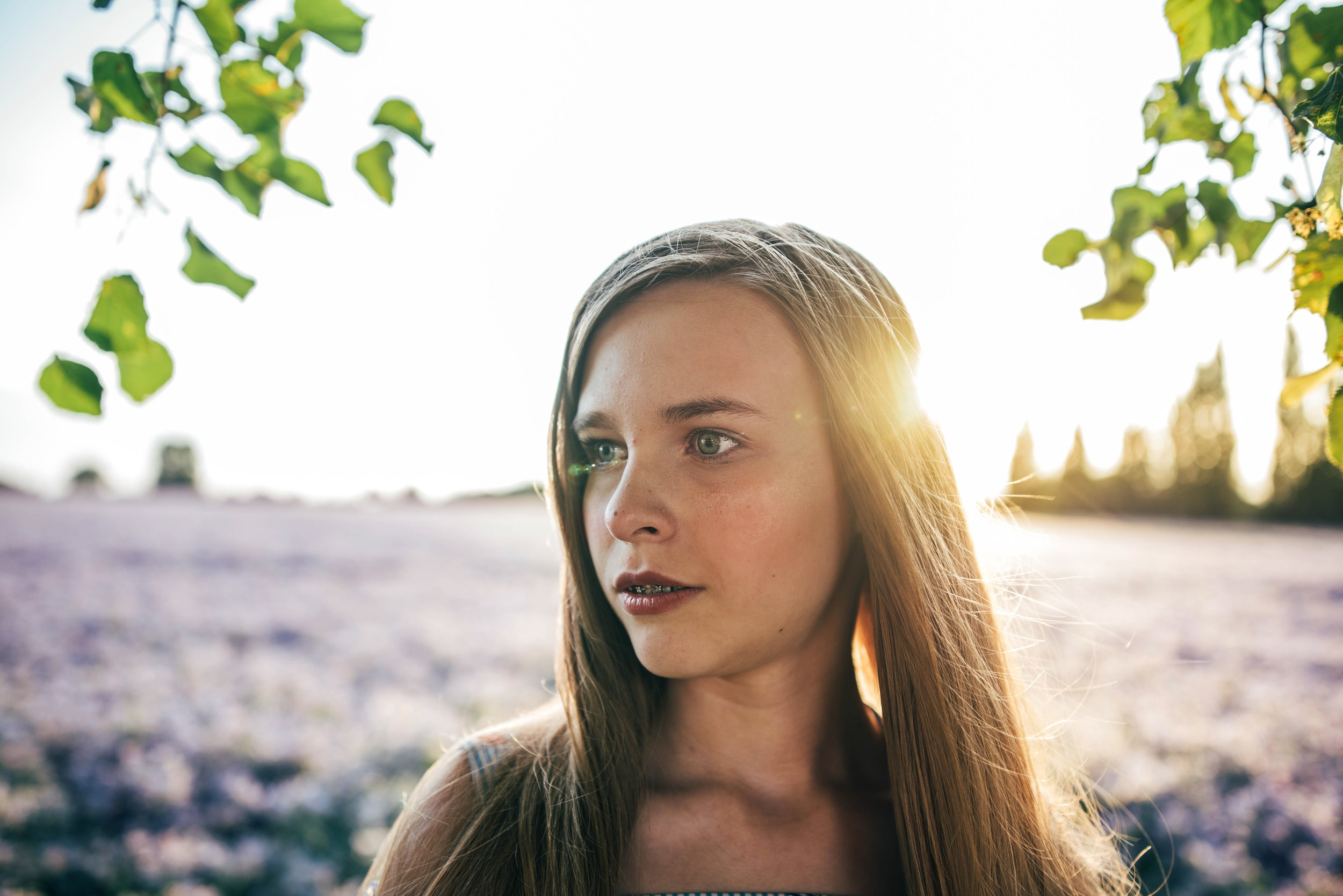 Teen girl in purple field at sunset Essex UK Documentary Portrait photographerw