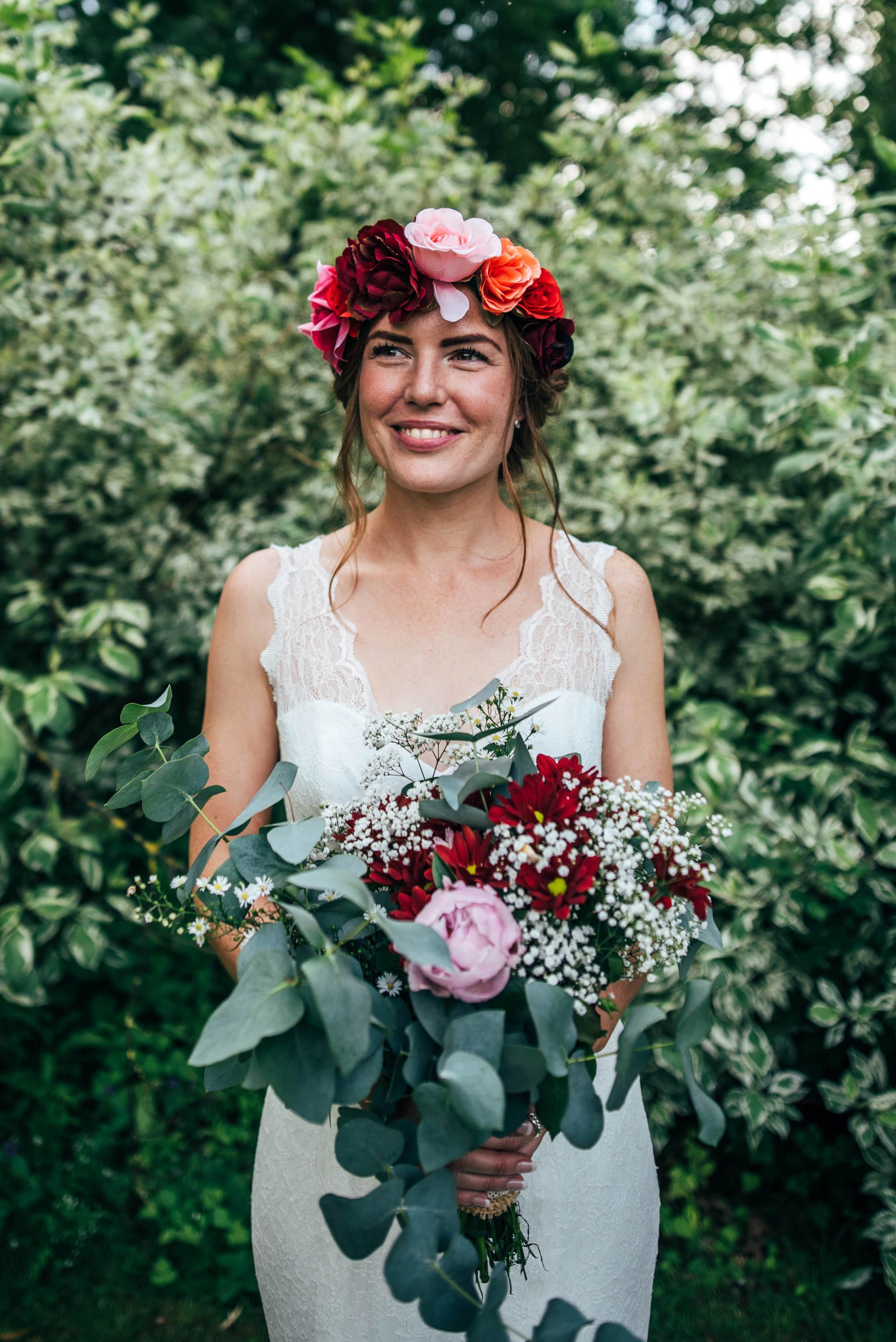 A Boho, Barefoot, DIY Wedding at Houchins, Essex. Bridesmaids in white with flower crowns, Groom in tweed with bowtie and Braces. Essex Documentary Wedding Photographer.