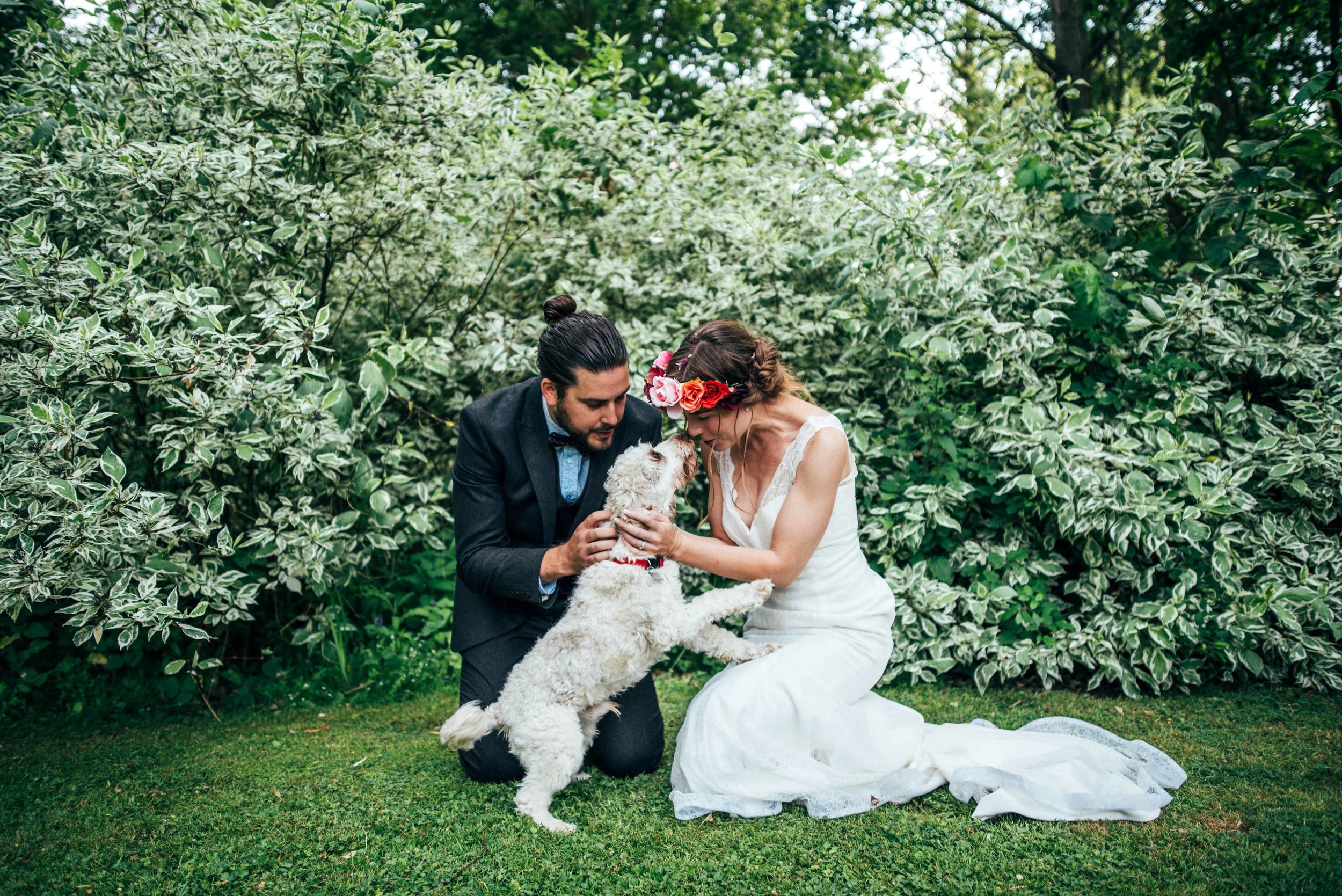 A Boho, Barefoot, DIY Wedding at Houchins, Essex. Bridesmaids in white with flower crowns, Groom in tweed with bowtie and Braces. Essex Documentary Wedding Photographer.