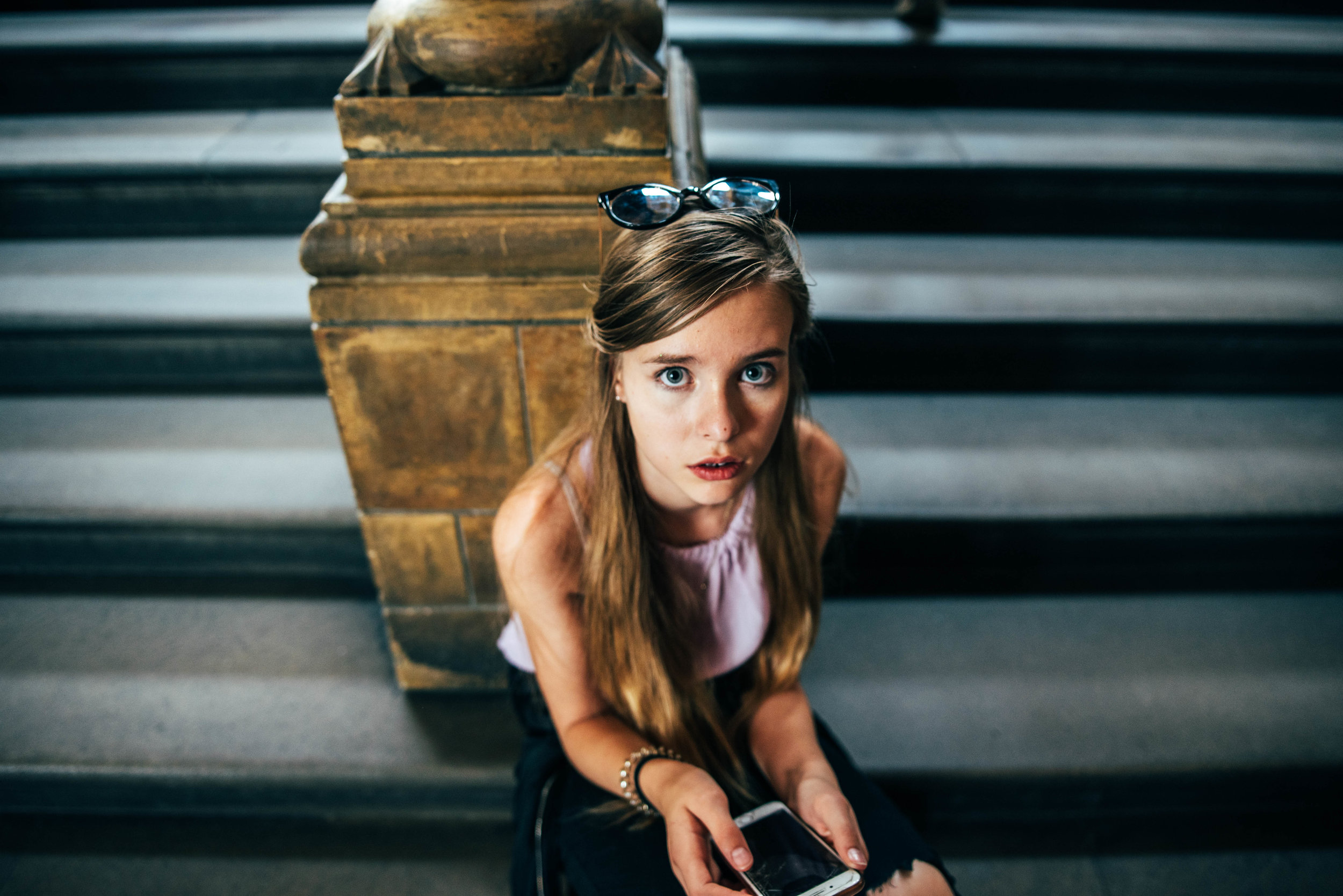 teen girl sits on steps at London Natural History Museum Essex UK Documentary Lifestyle Wedding Photographer