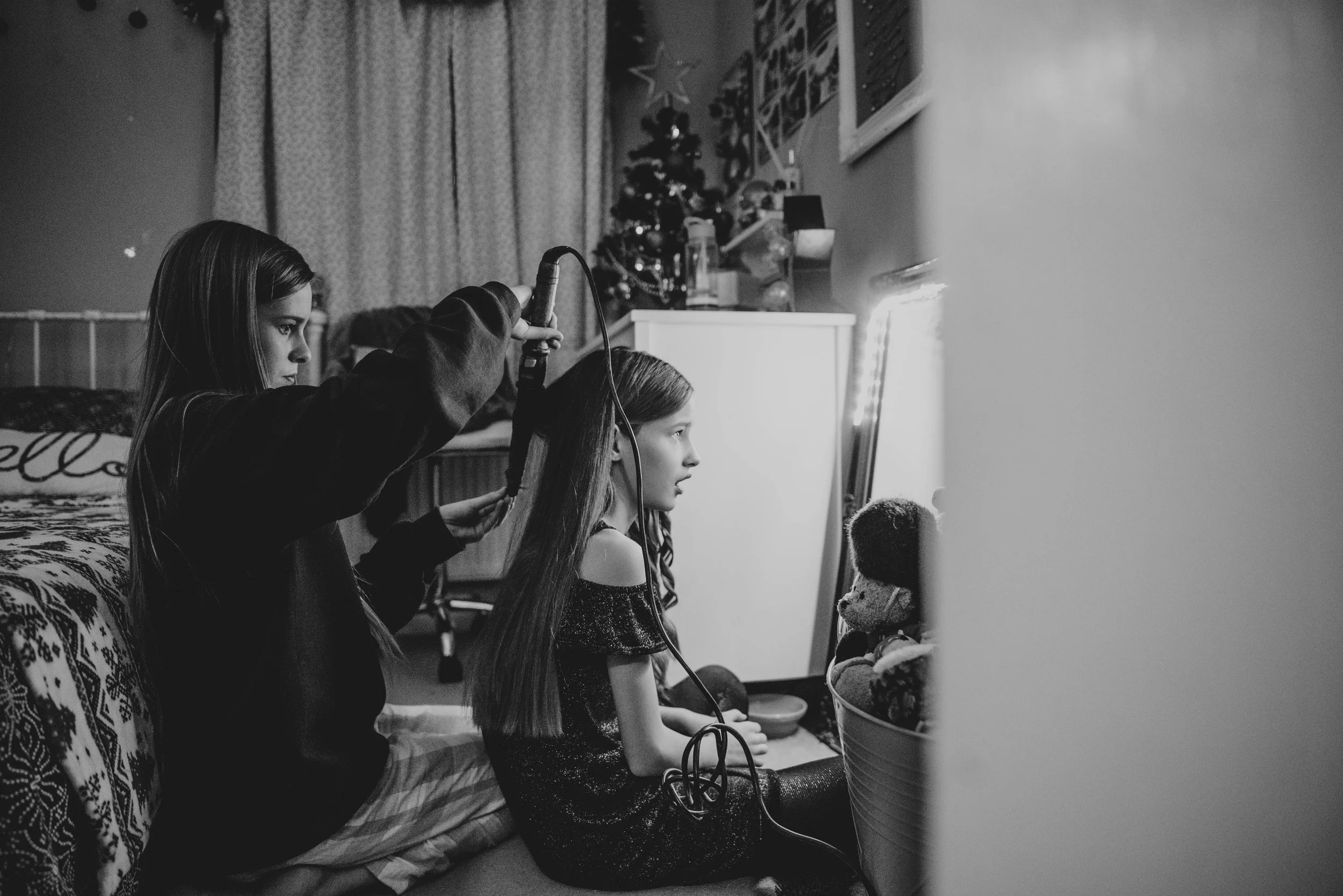 Tween sisters doing hair Essex UK Wedding Documentary Photographer